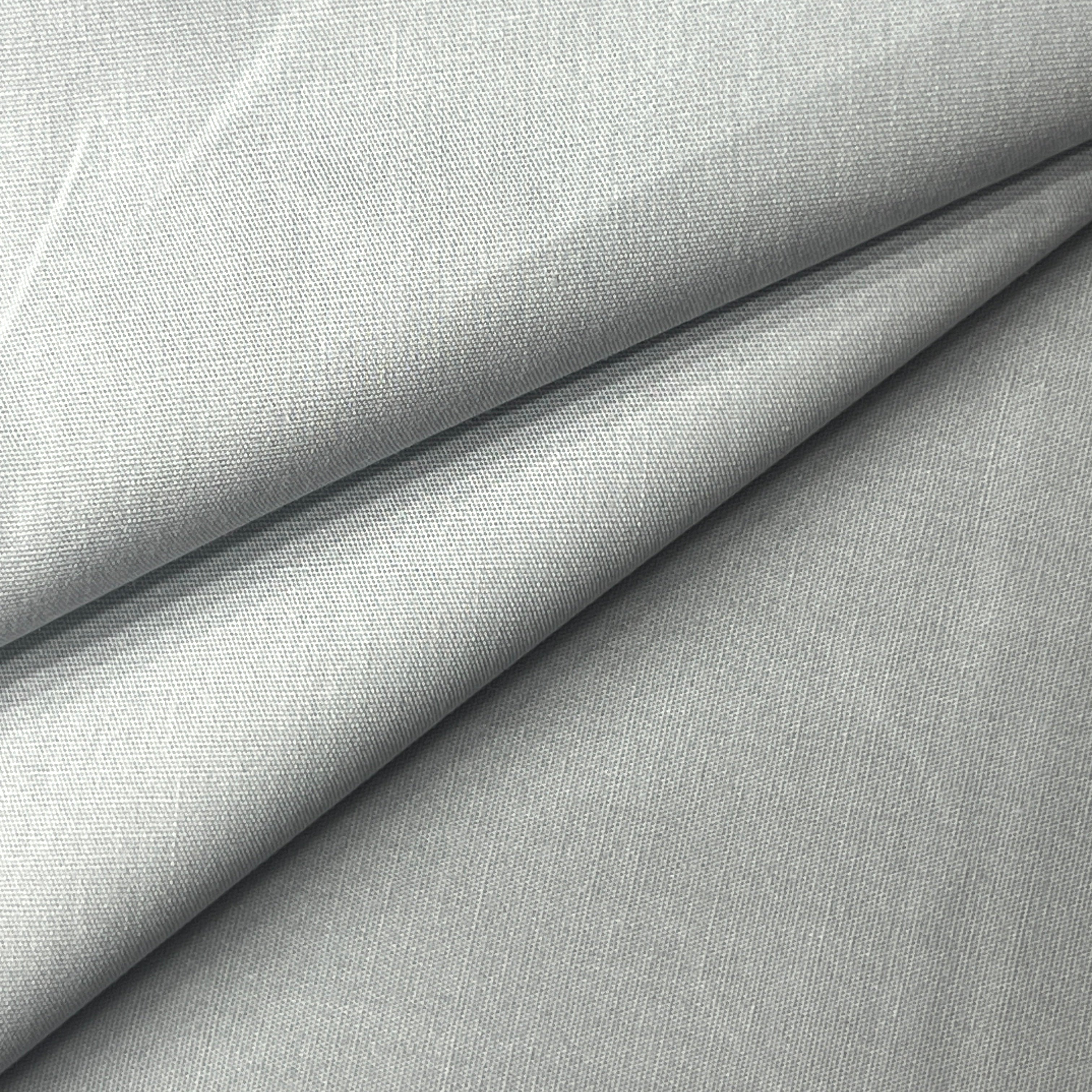 100% Cotton Poplin fabric in a plain weave, shown in grey with a smooth texture and visible weave pattern.