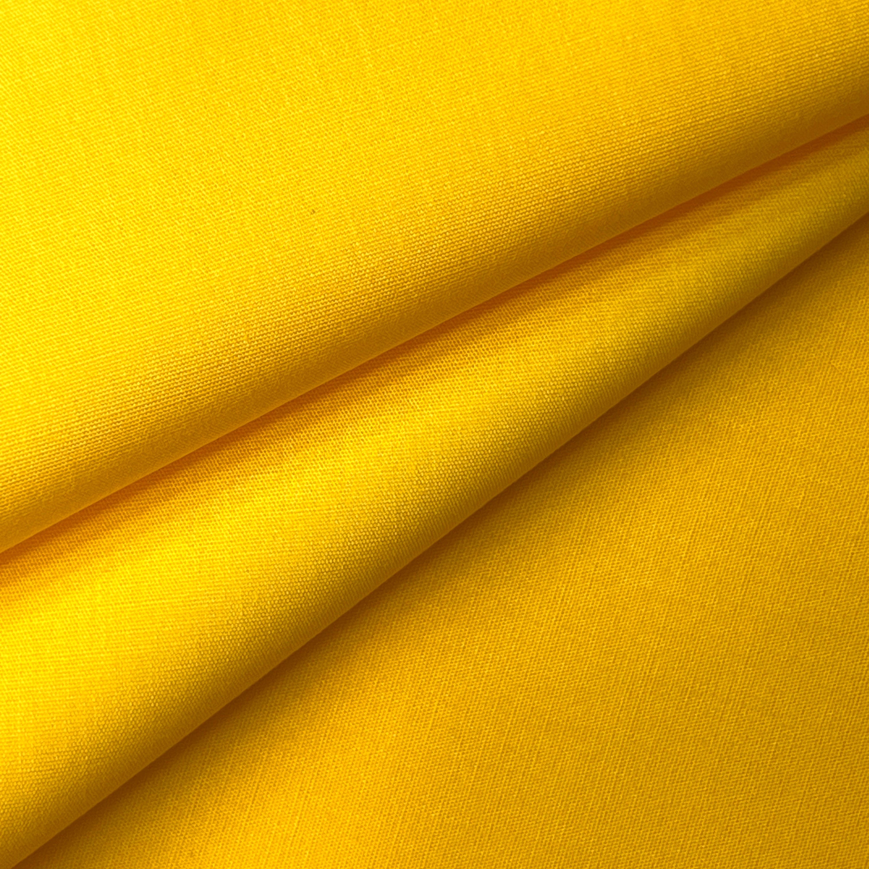 Yellow 100% cotton poplin fabric with a plain weave texture.