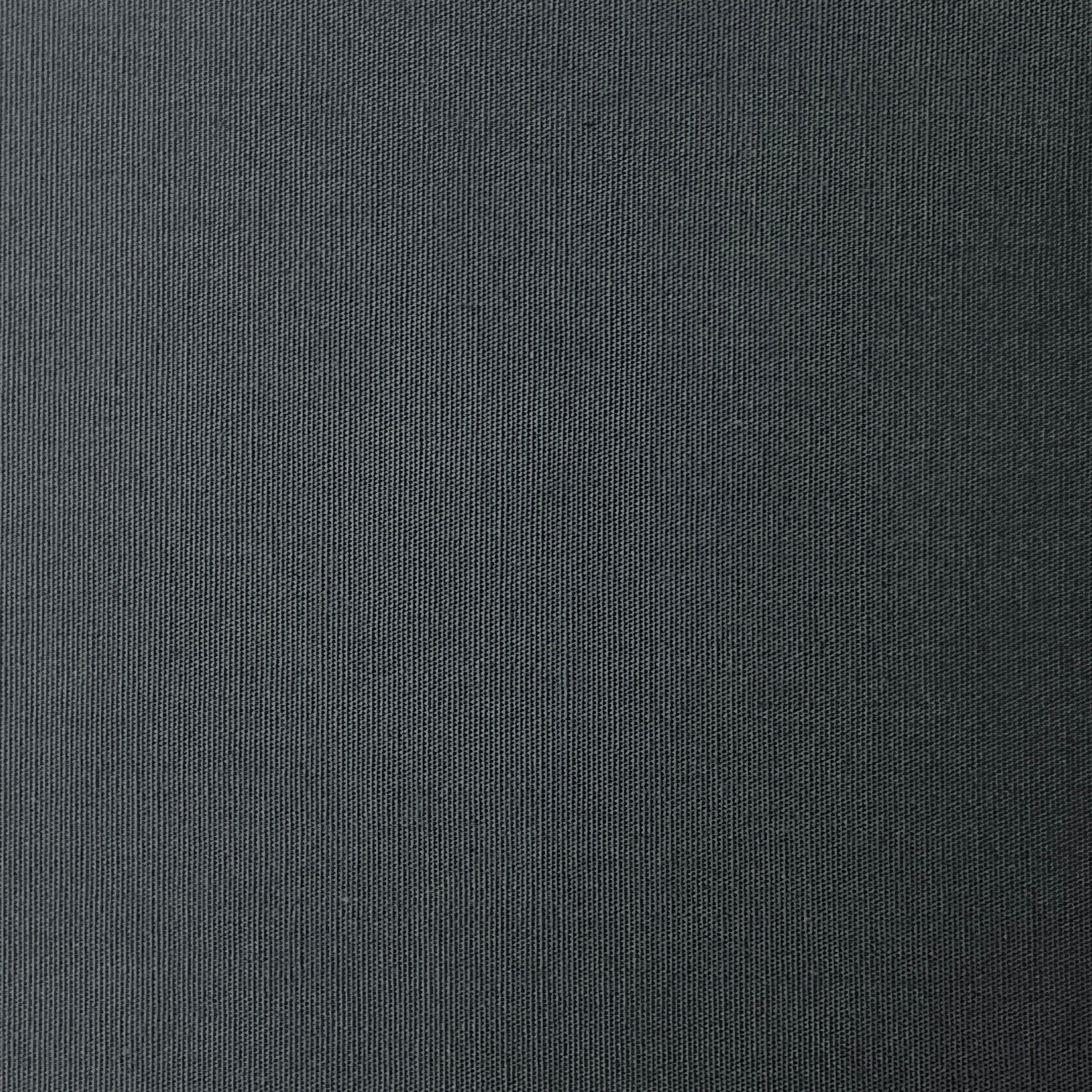 Close-up of grey 100% cotton poplin plain weave fabric showing its fine, smooth texture.
