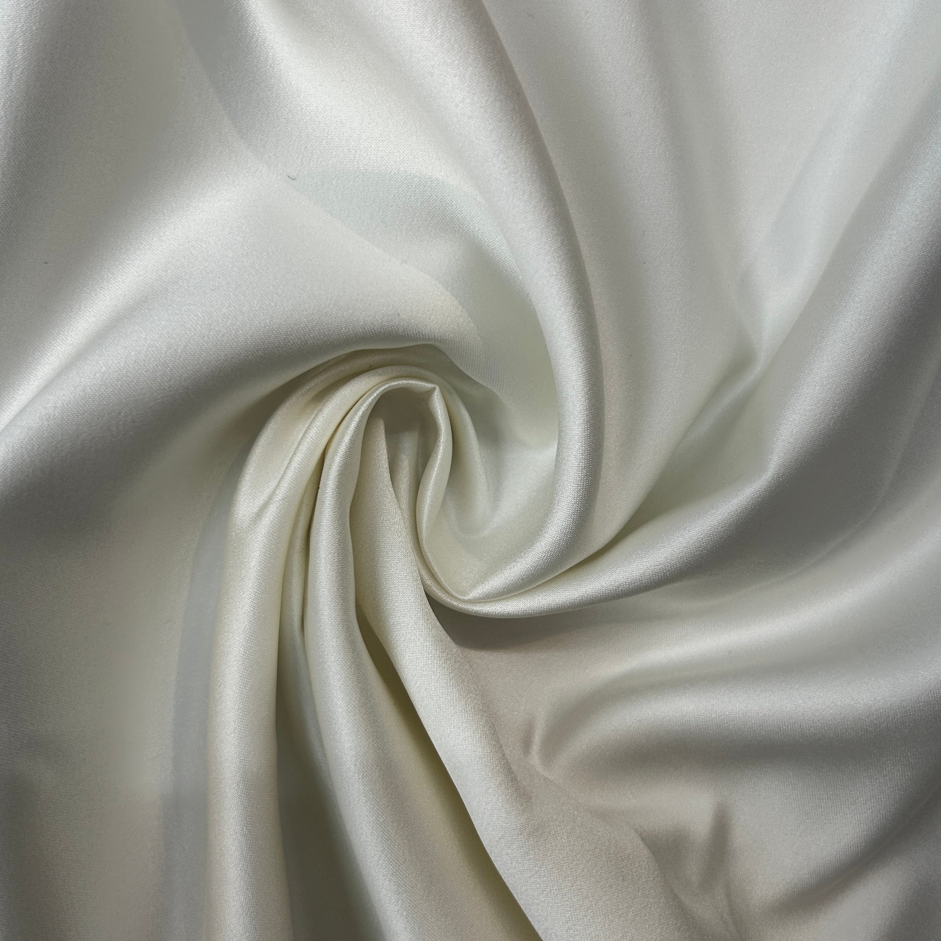 Close-up of white fabric with a swirl pattern