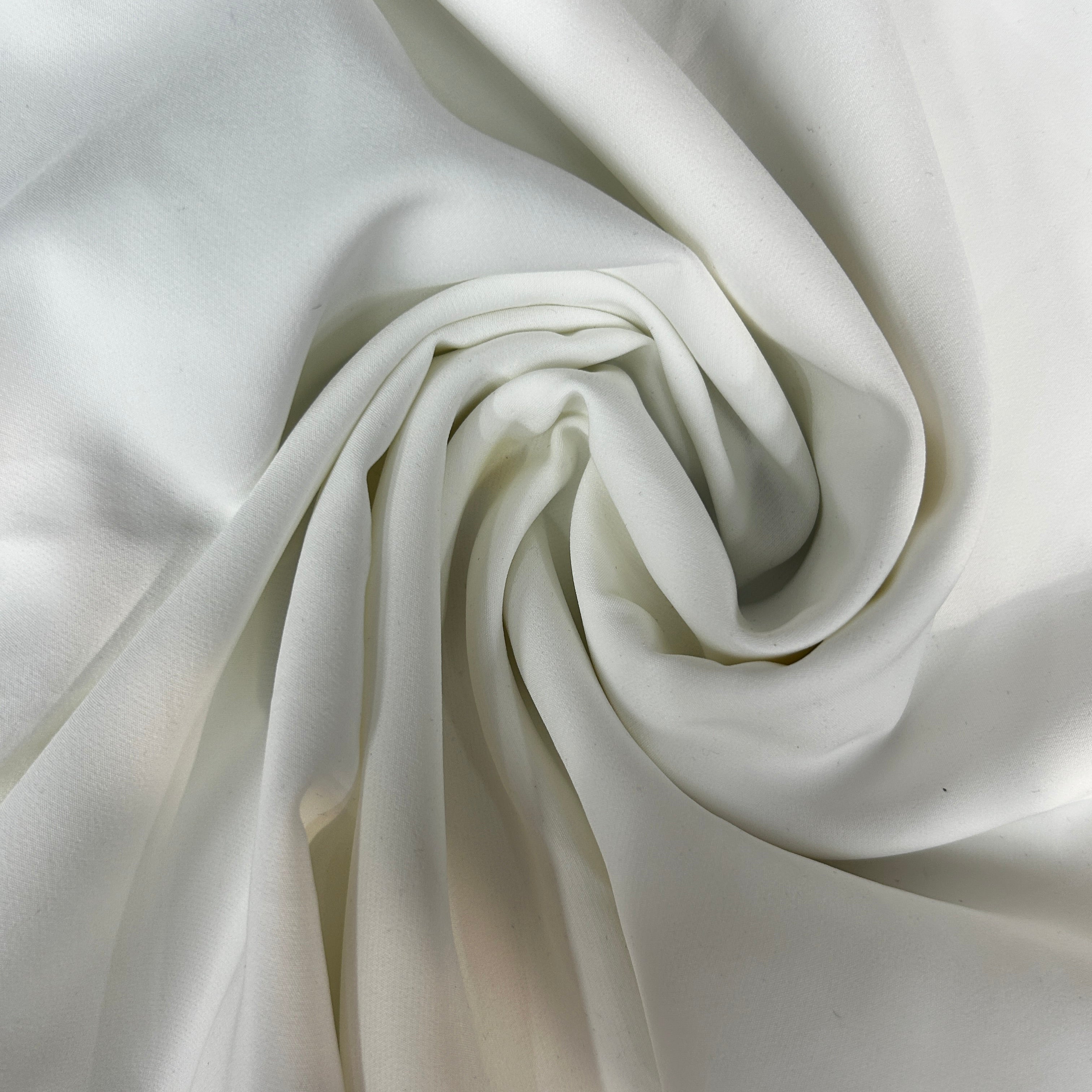Close-up of white fabric with folds