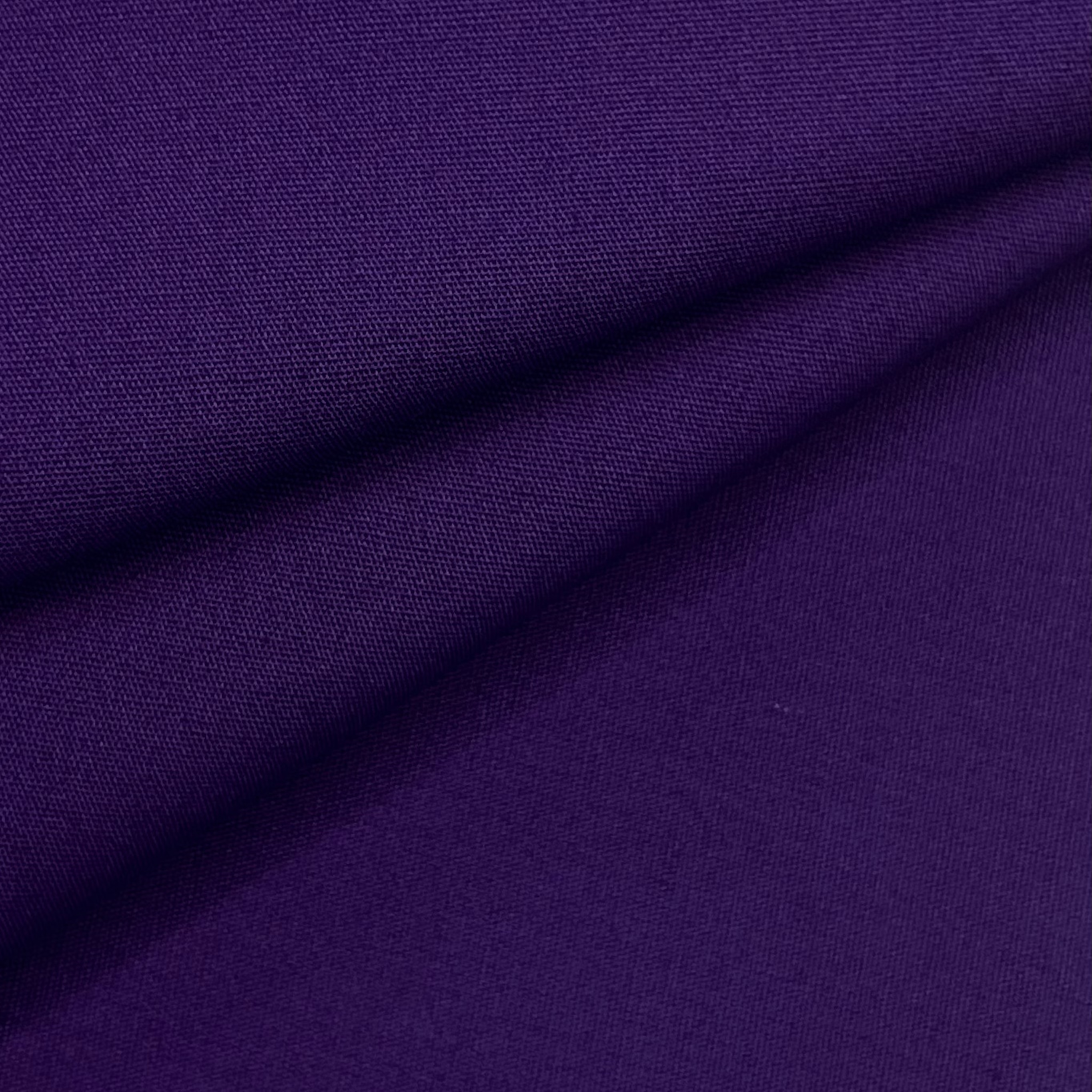 A swatch of deep purple cotton poplin fabric with a visible weave.