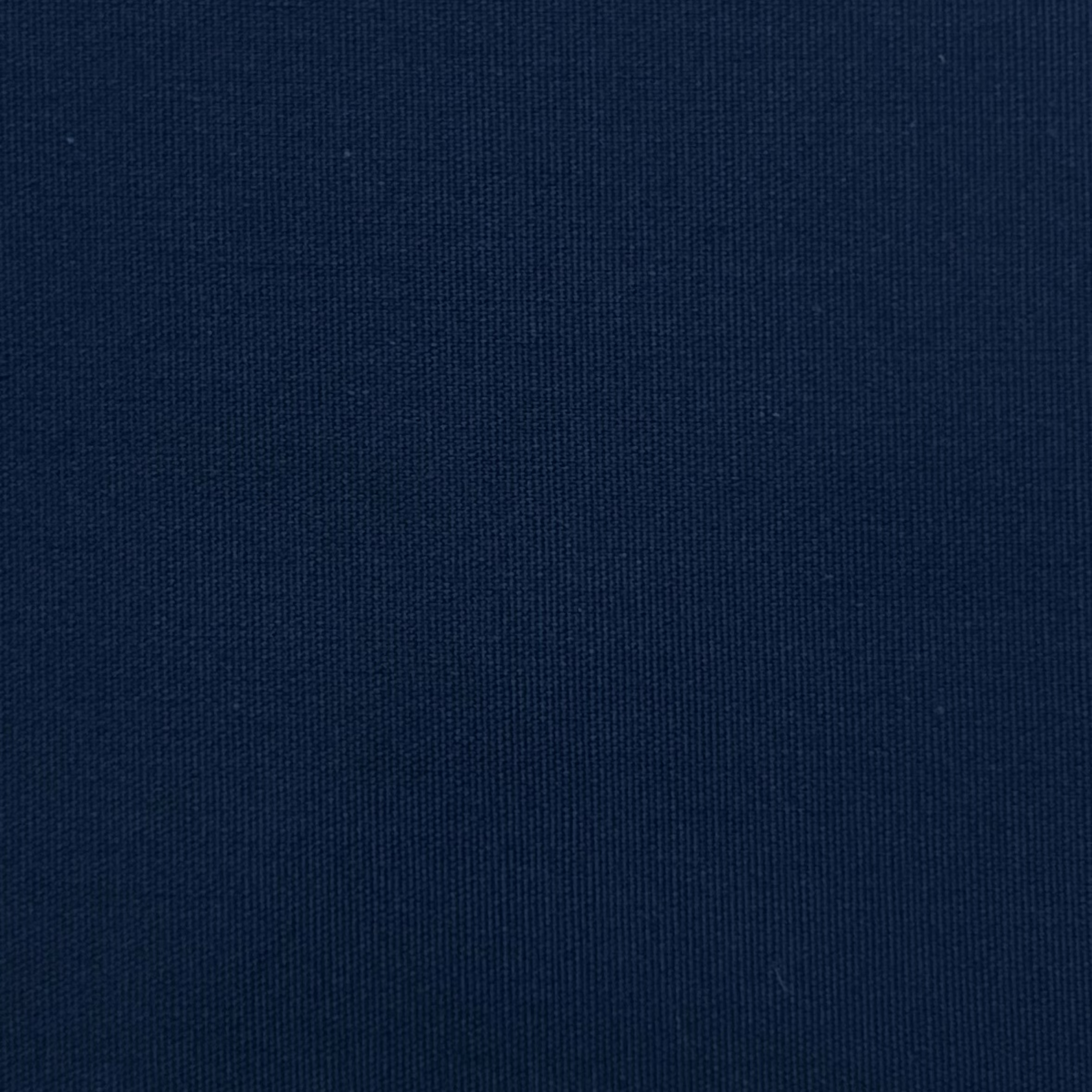 A close-up view of navy blue cotton poplin fabric showing its fine, smooth plain weave texture.