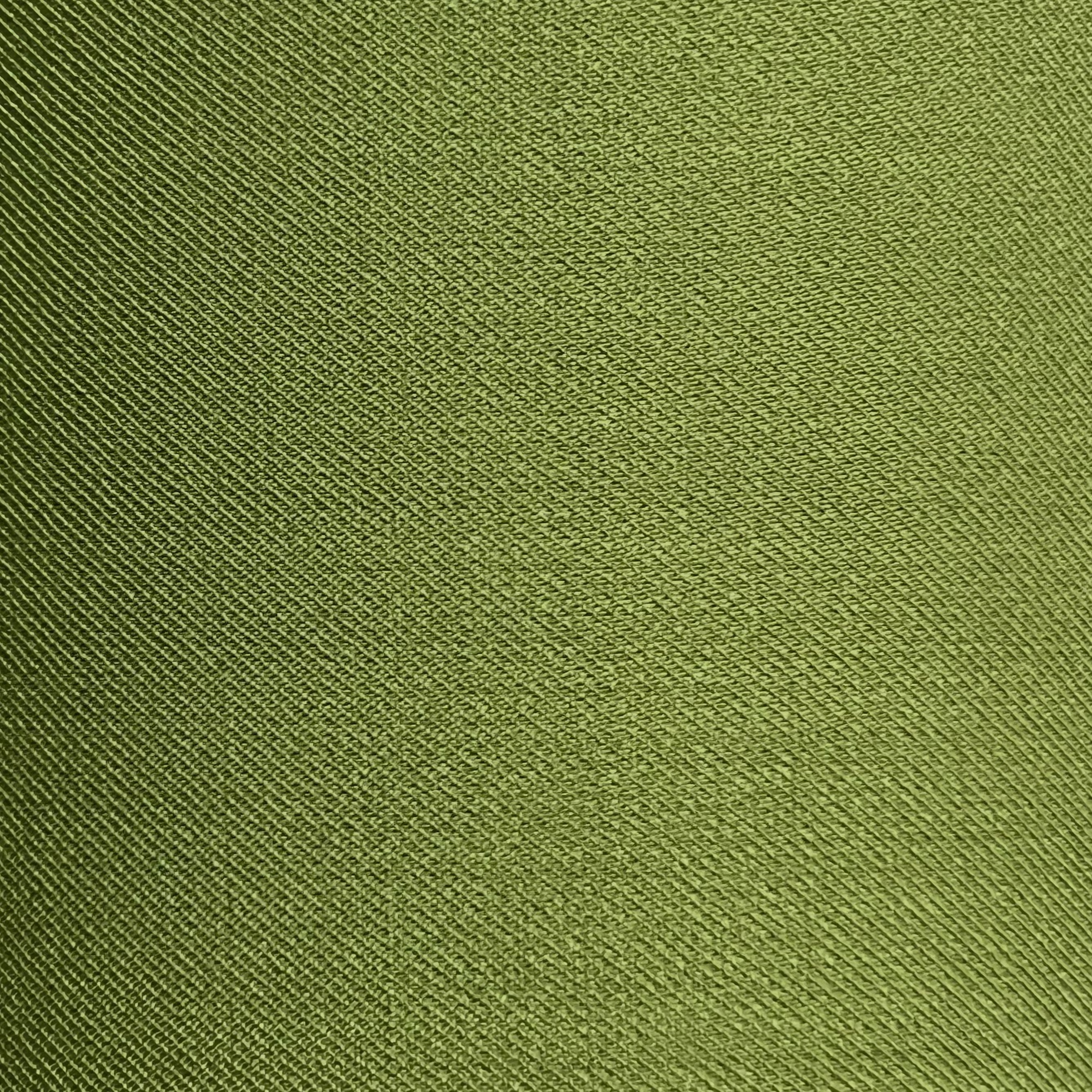 Close-up of olive green virgin wool and silk tweed fabric with a fine diagonal ribbed texture.