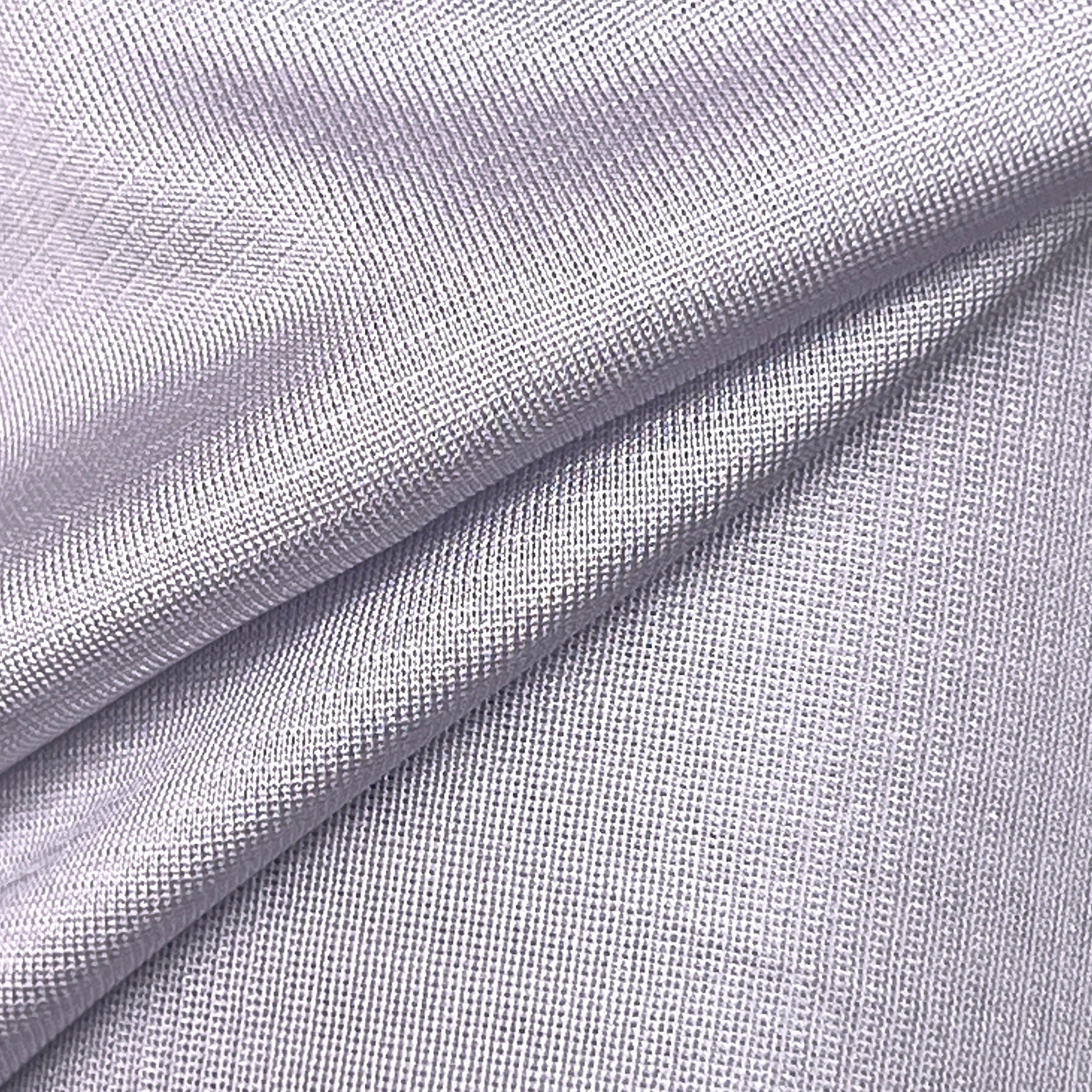 A close-up of light lavender-gray textured fabric with soft diagonal folds showing a fine woven pattern.