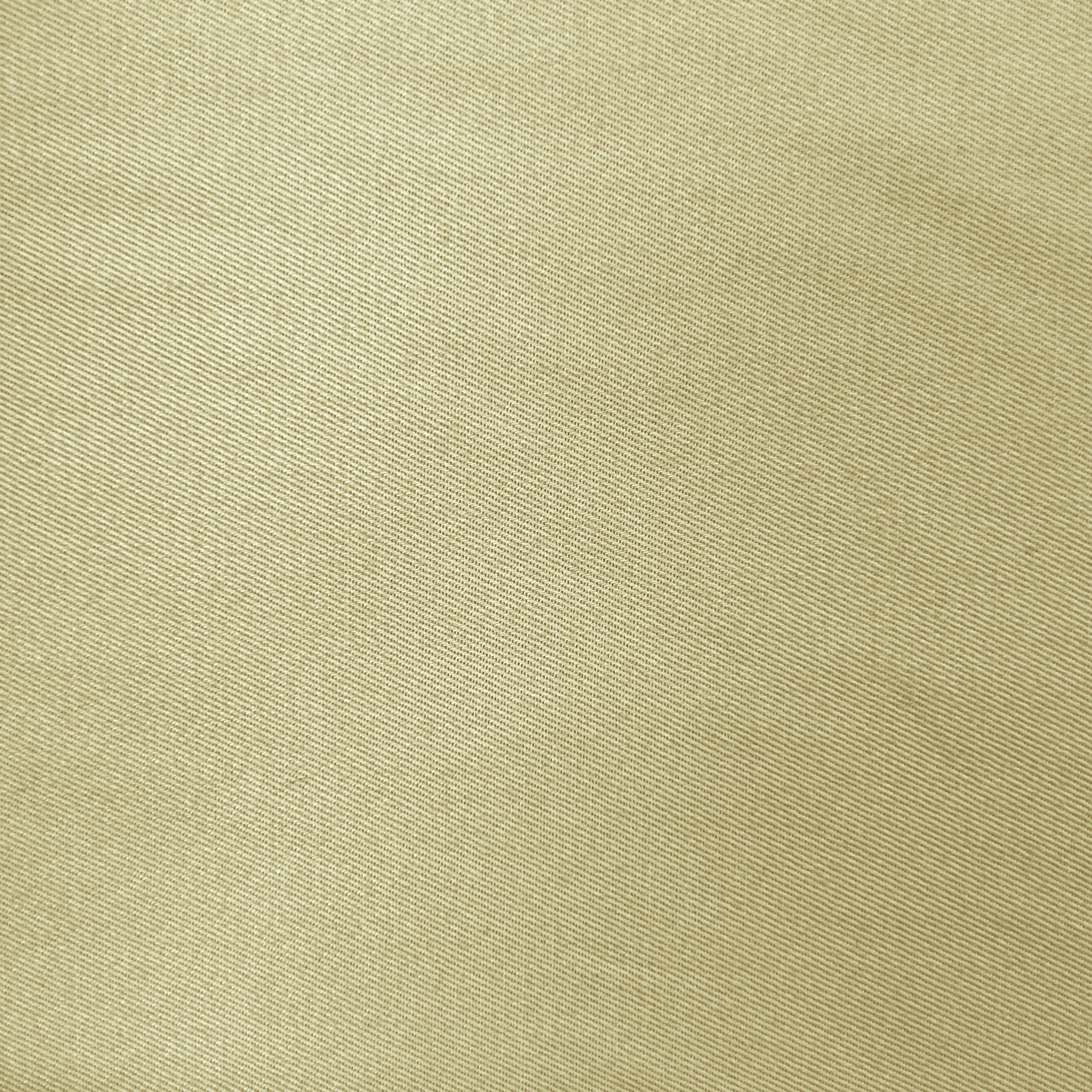 A close-up of a textured fabric with a fine diagonal twill weave in a warm beige-gold color.
