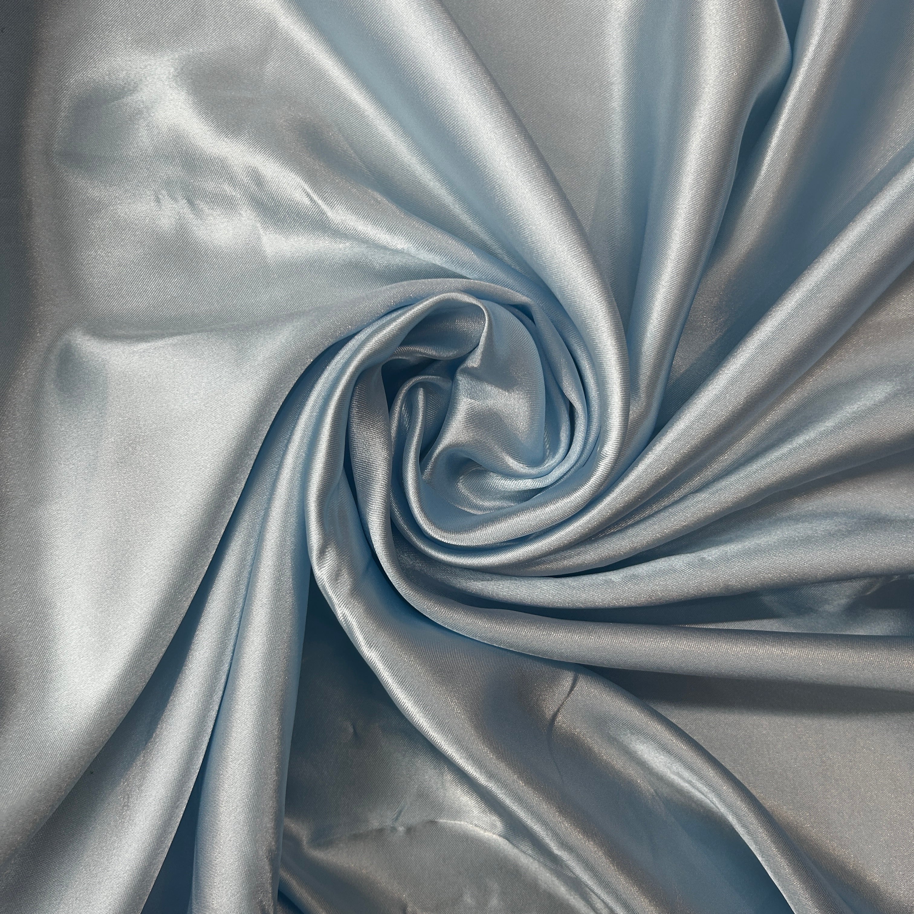 Close-up of silver fabric with folds