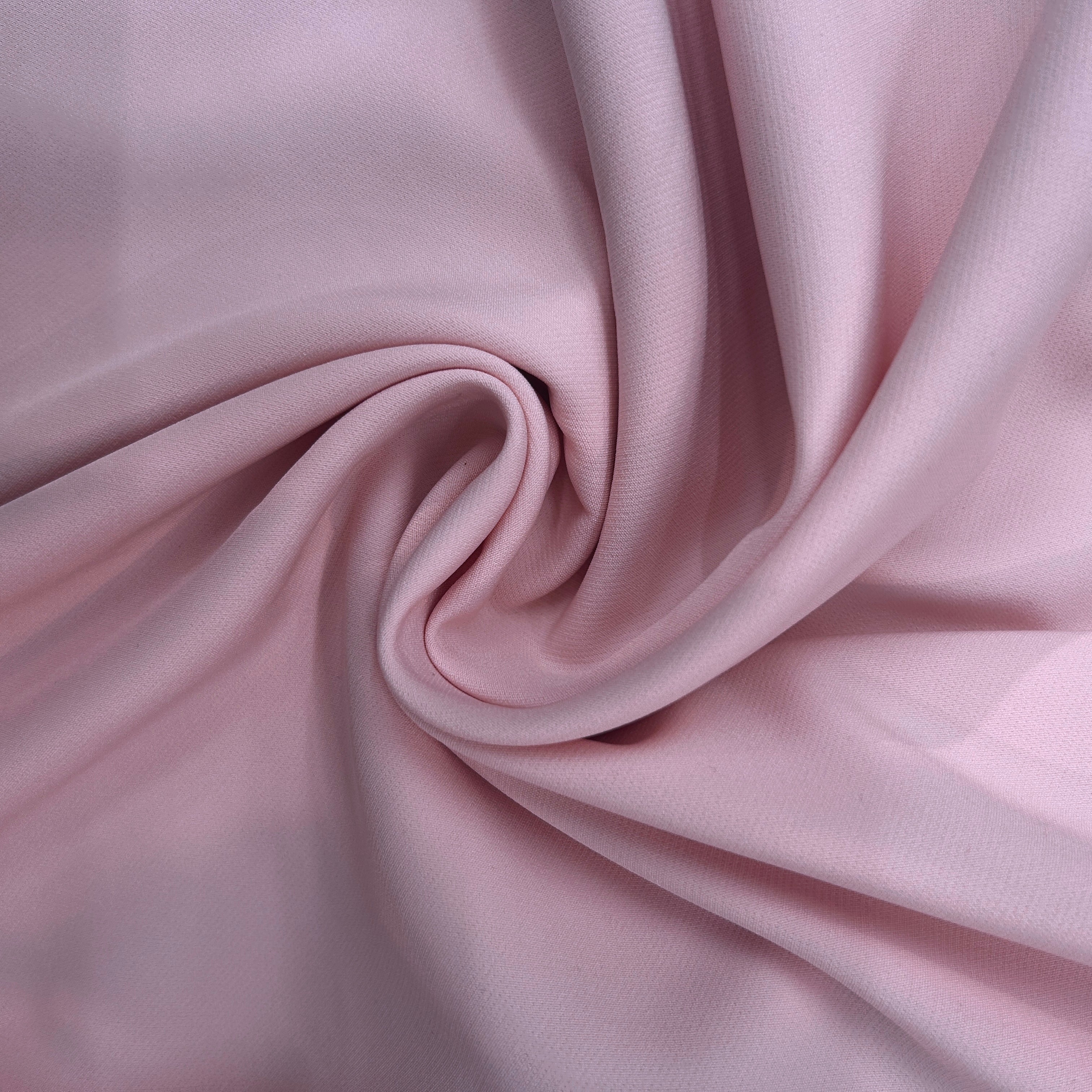 Close-up of pink fabric with folds