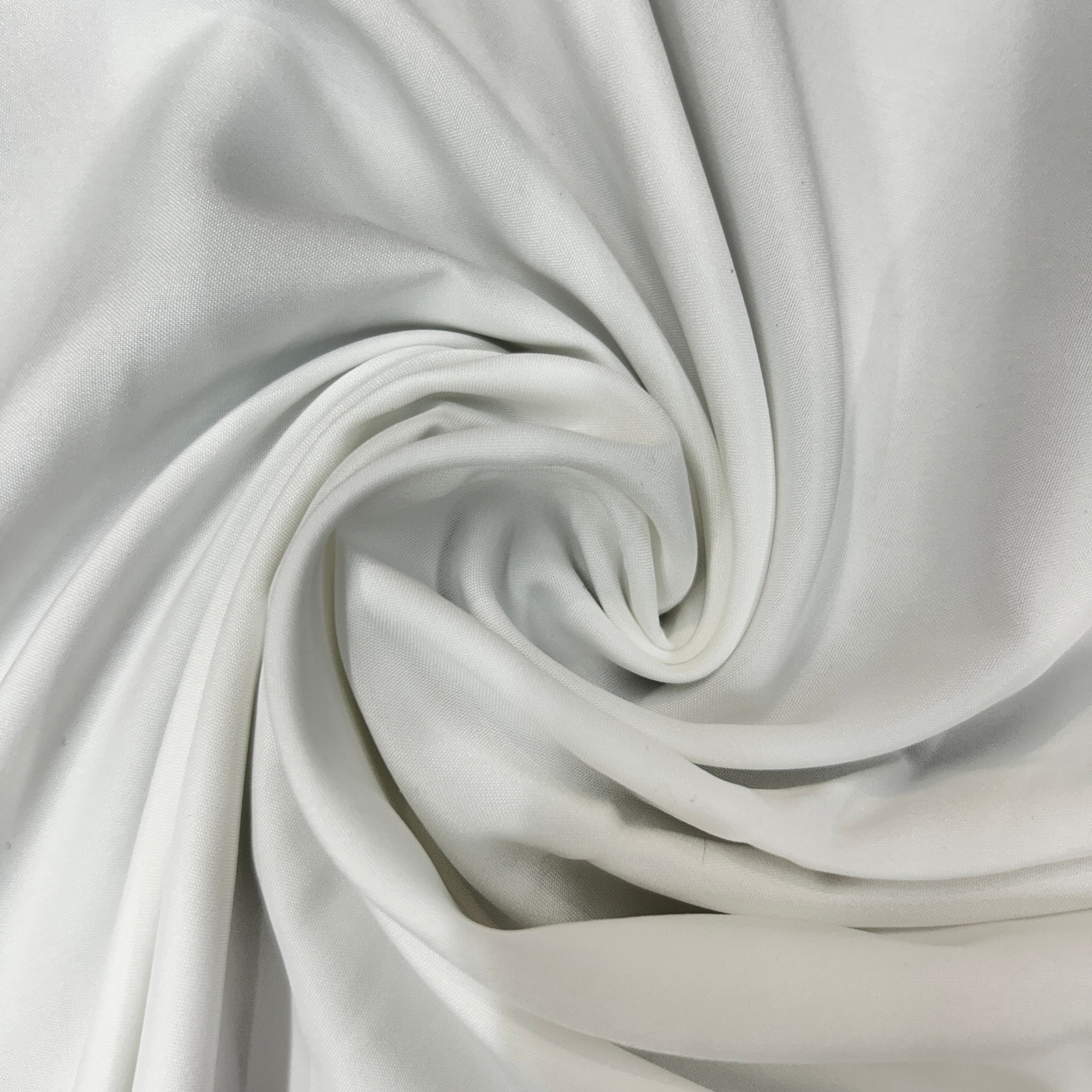 White mechanical stretch polyester fabric swirled to show its drape and smooth texture.