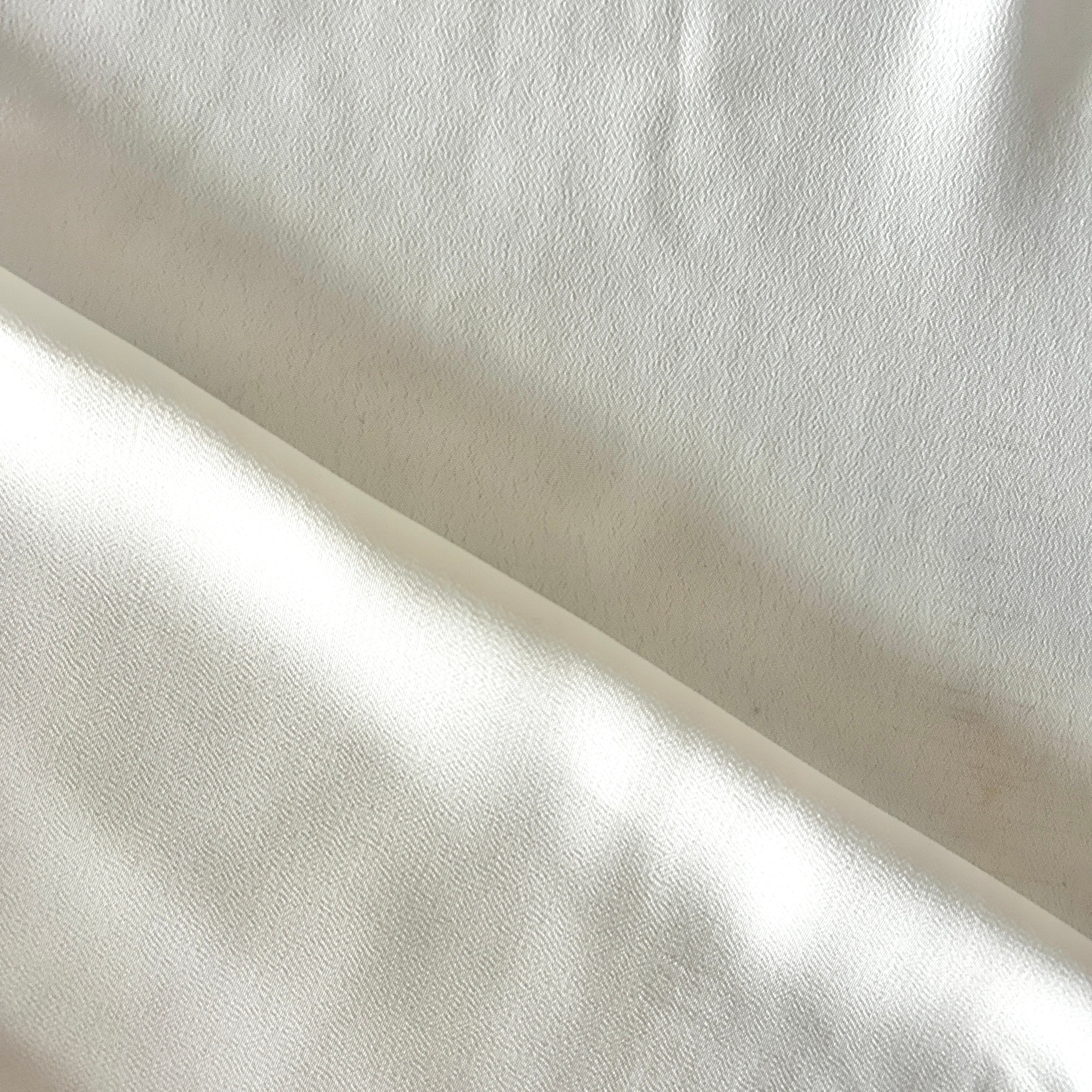 Close-up of white fabric with a subtle texture