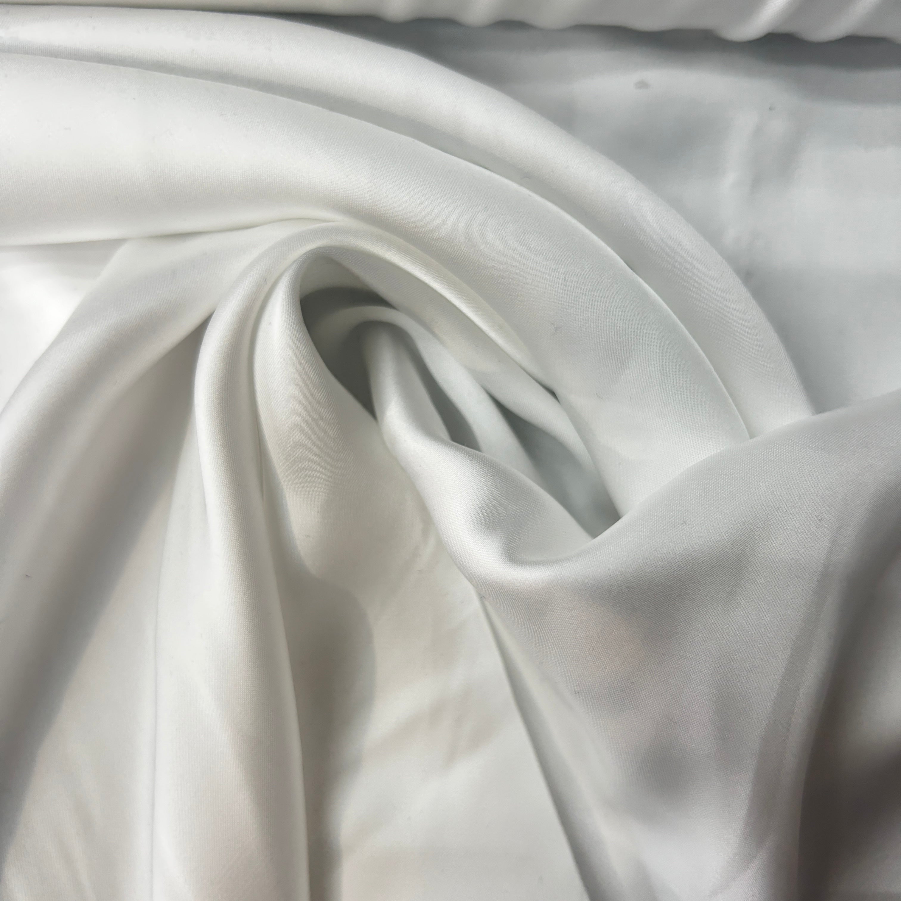 Close-up of white fabric with folds