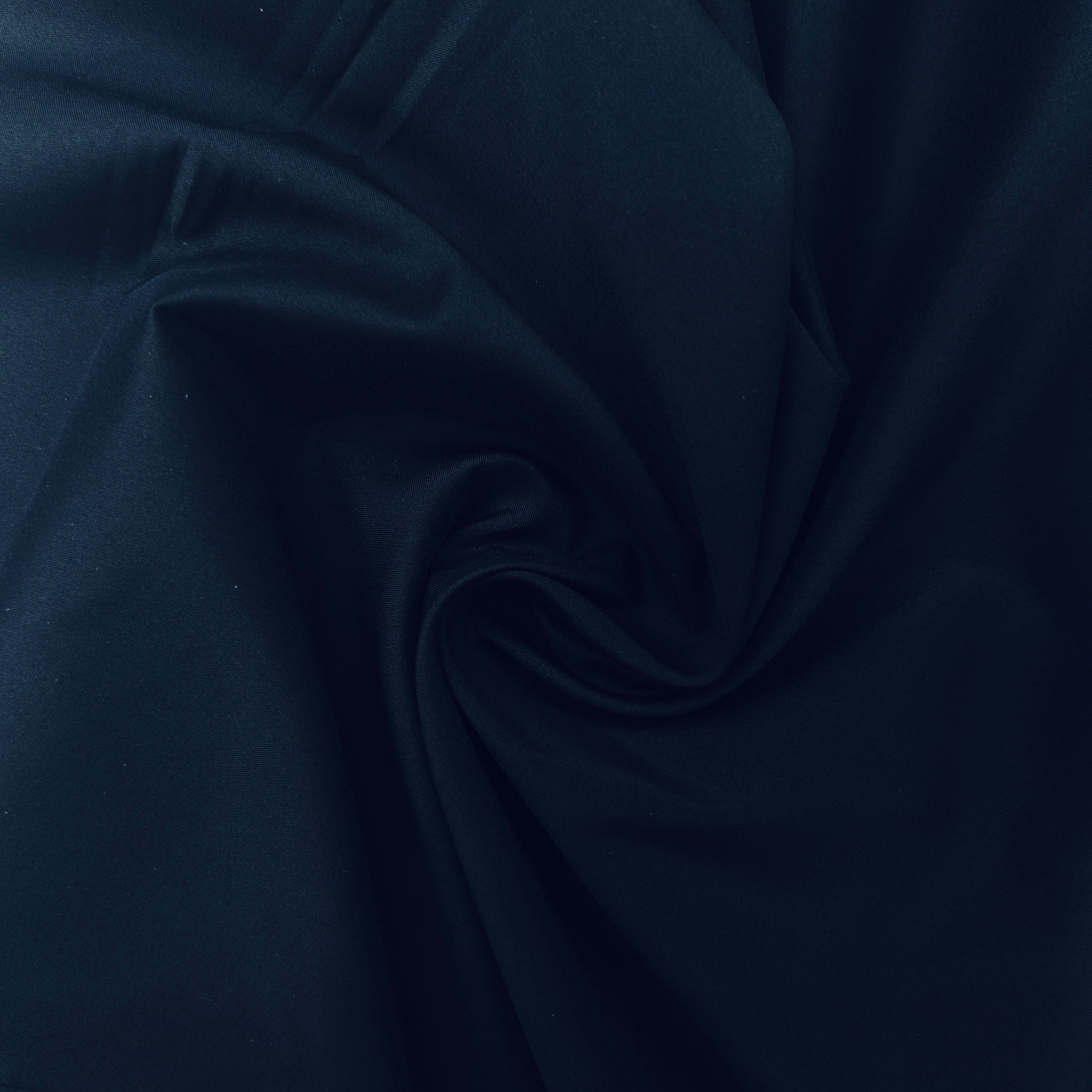 Close-up of dark blue fabric with folds