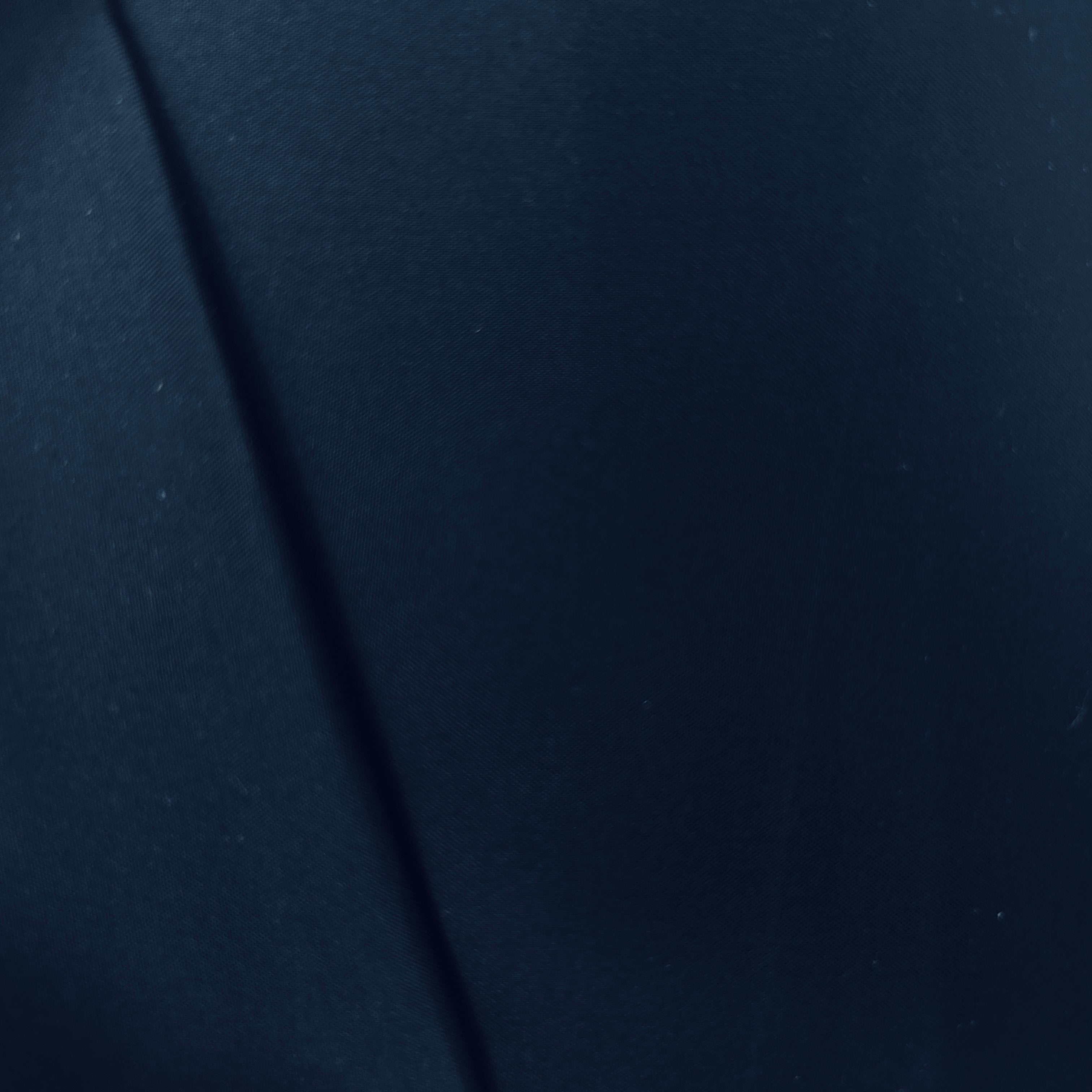 Navy blue fabric texture with a diagonal line