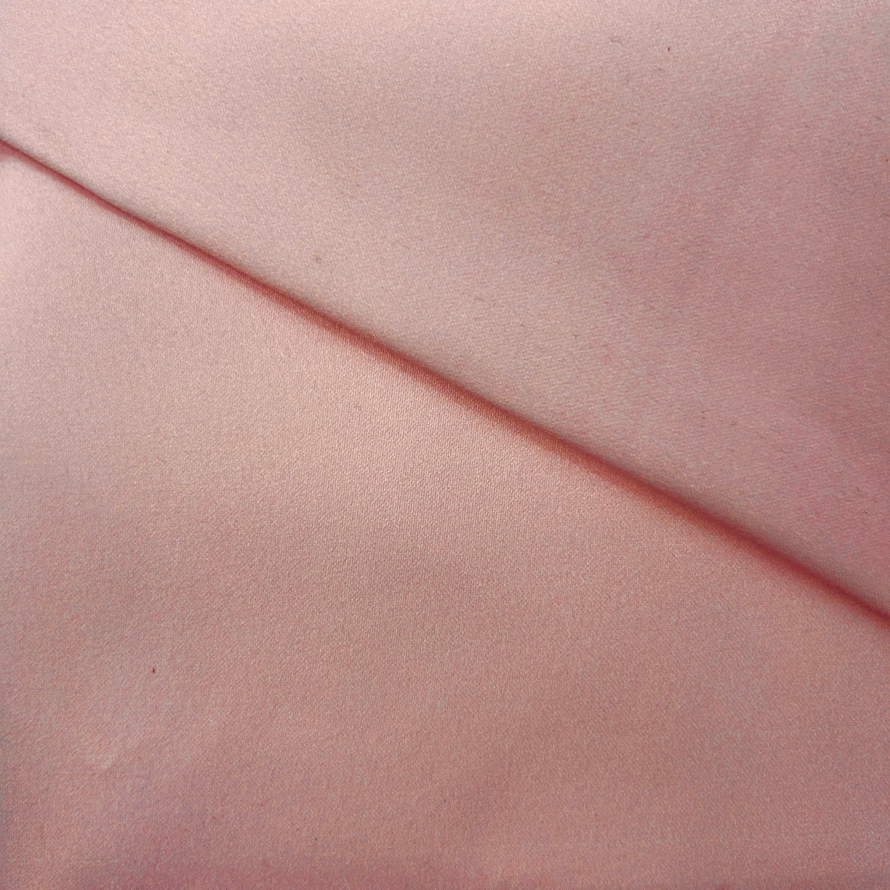 Close-up of pink fabric with a diagonal line