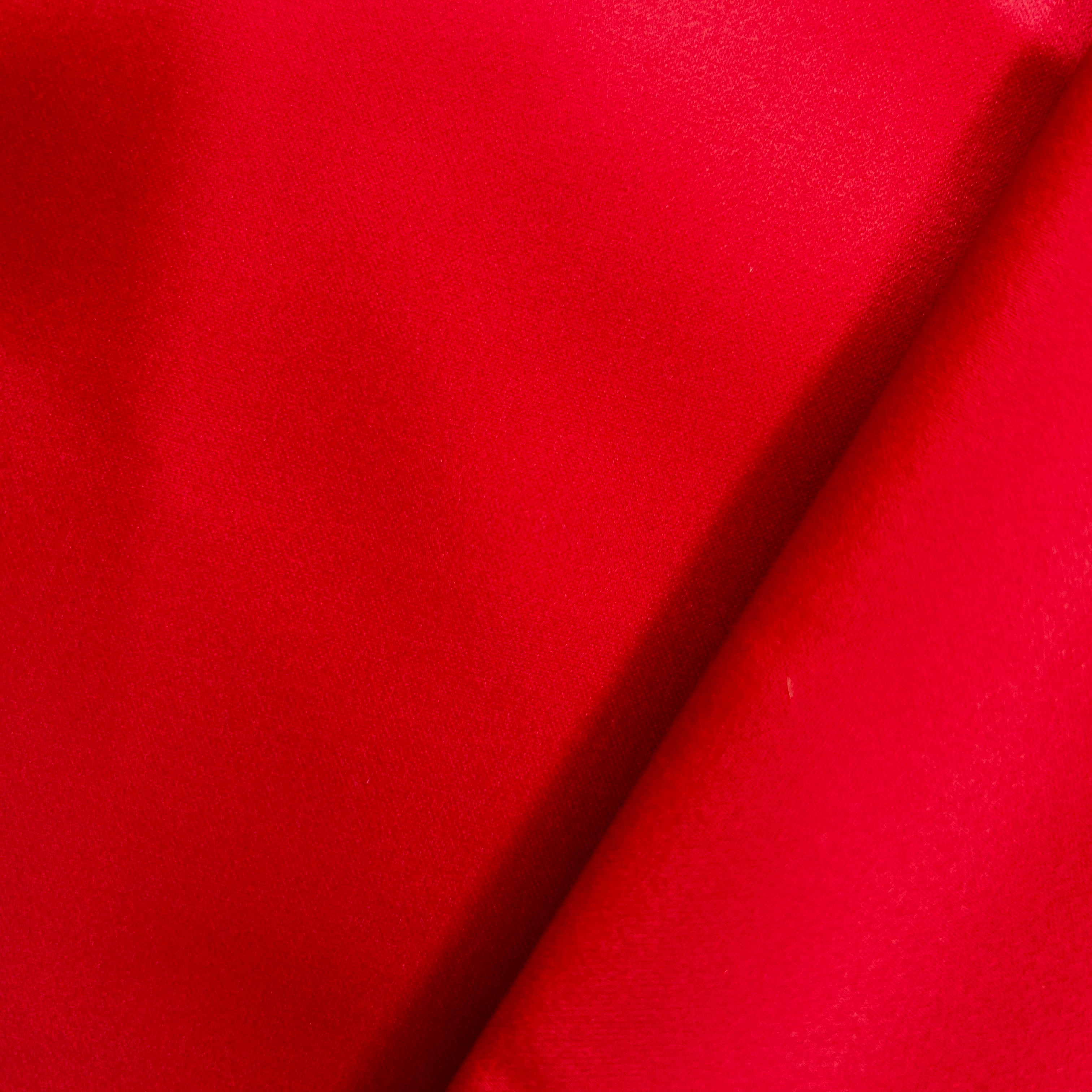 Close-up of red fabric with a diagonal line