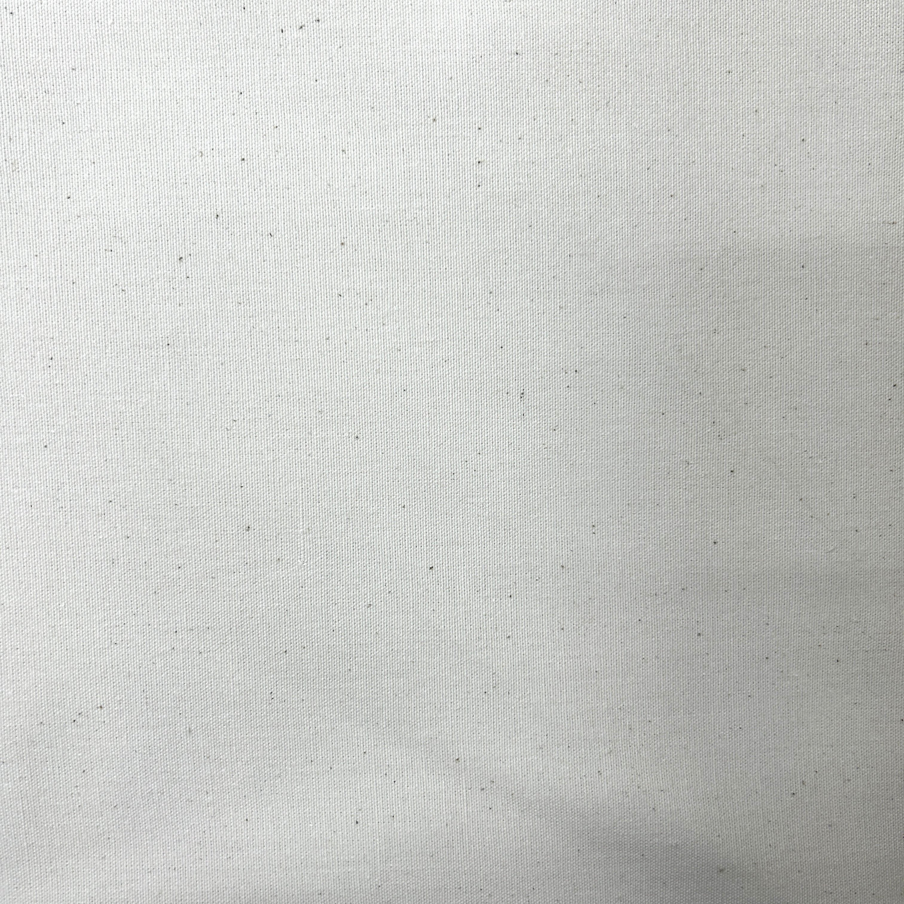 A close-up of a light gray textured fabric with subtle speckles and a fine woven pattern.