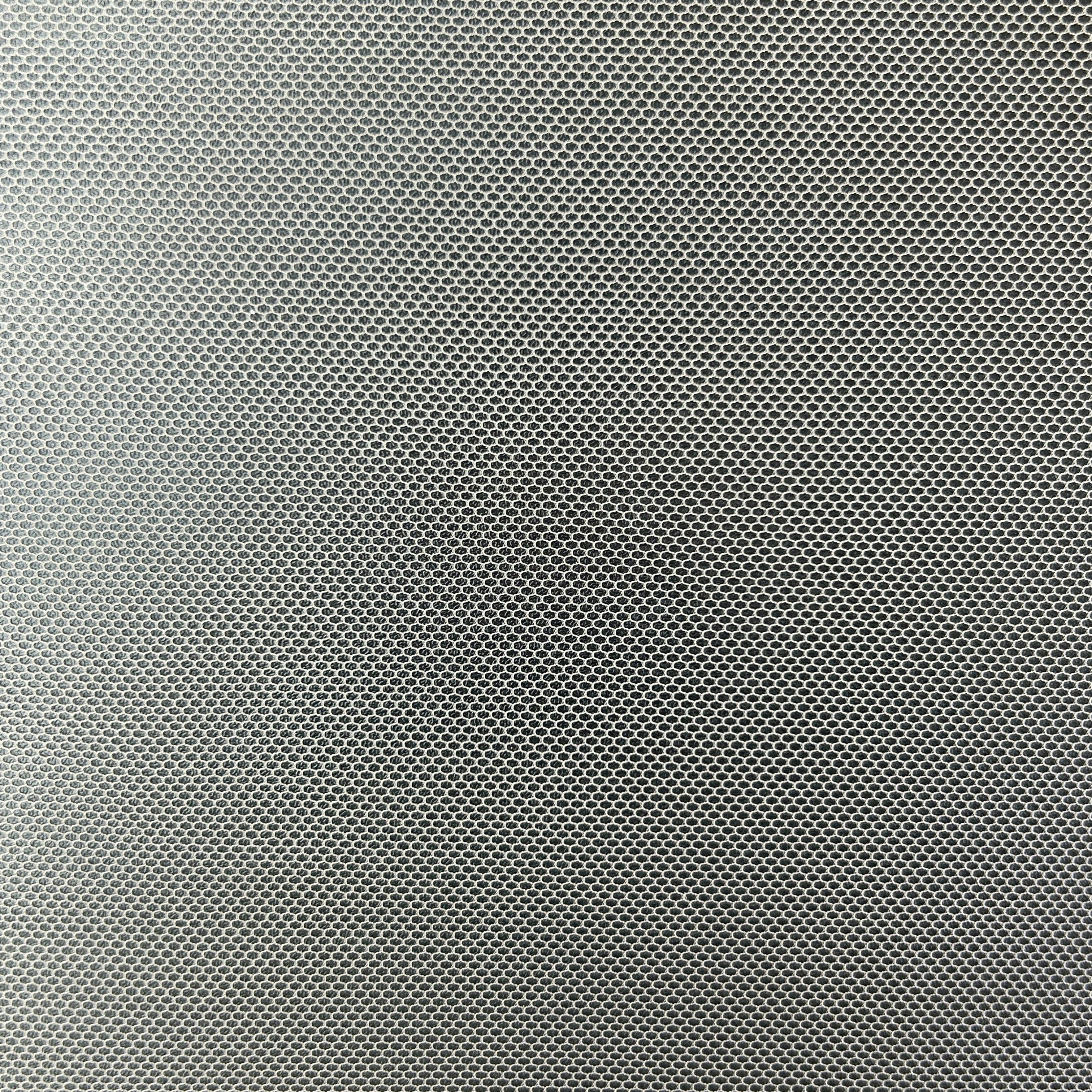 A close-up texture shot of a dark gray metallic mesh or woven fabric with a fine, repeating diamond pattern.