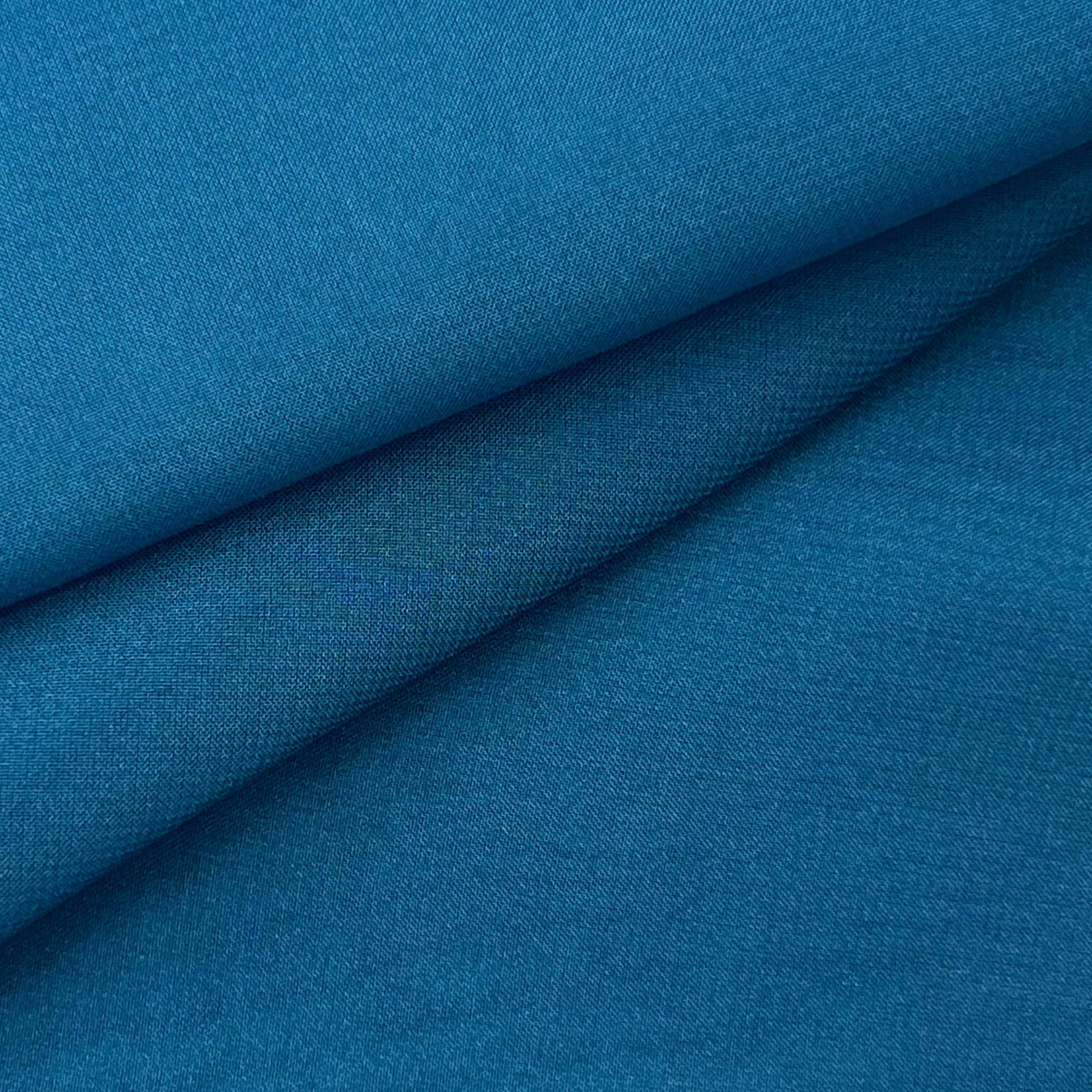 A folded piece of ultra-thin, matte teal polyester chiffon fabric.