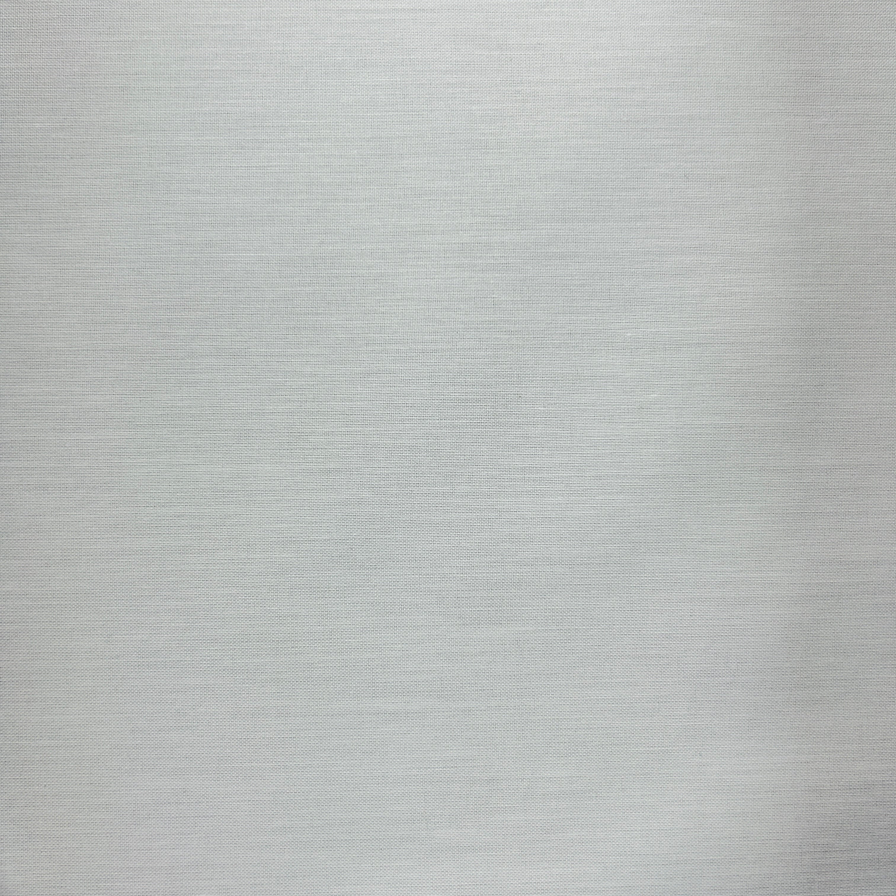 A close-up of a light gray brushed metal or textured fabric surface filling the frame.