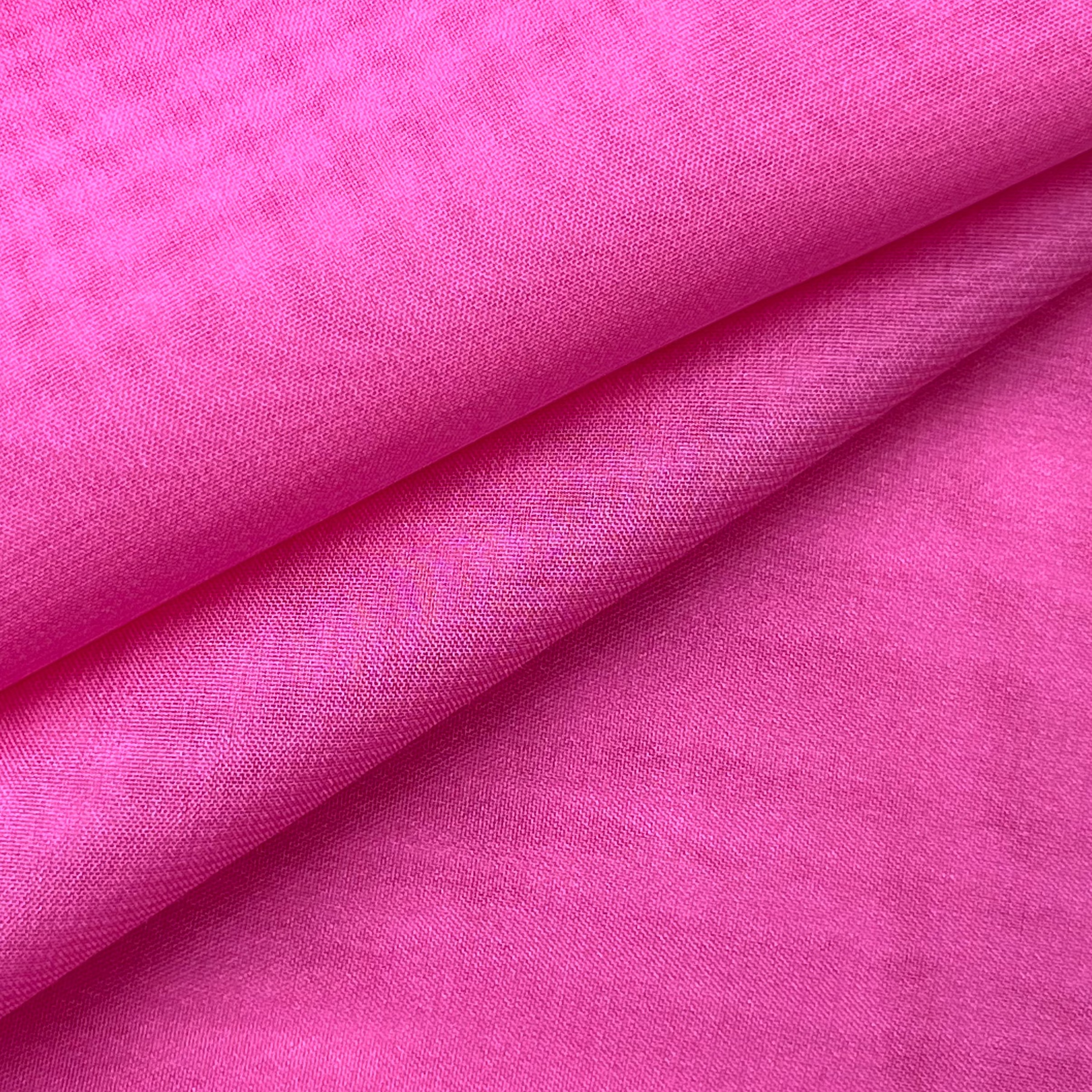 High quality ultra thin pink polyester chiffon fabric with a soft matte texture and fluid drape.