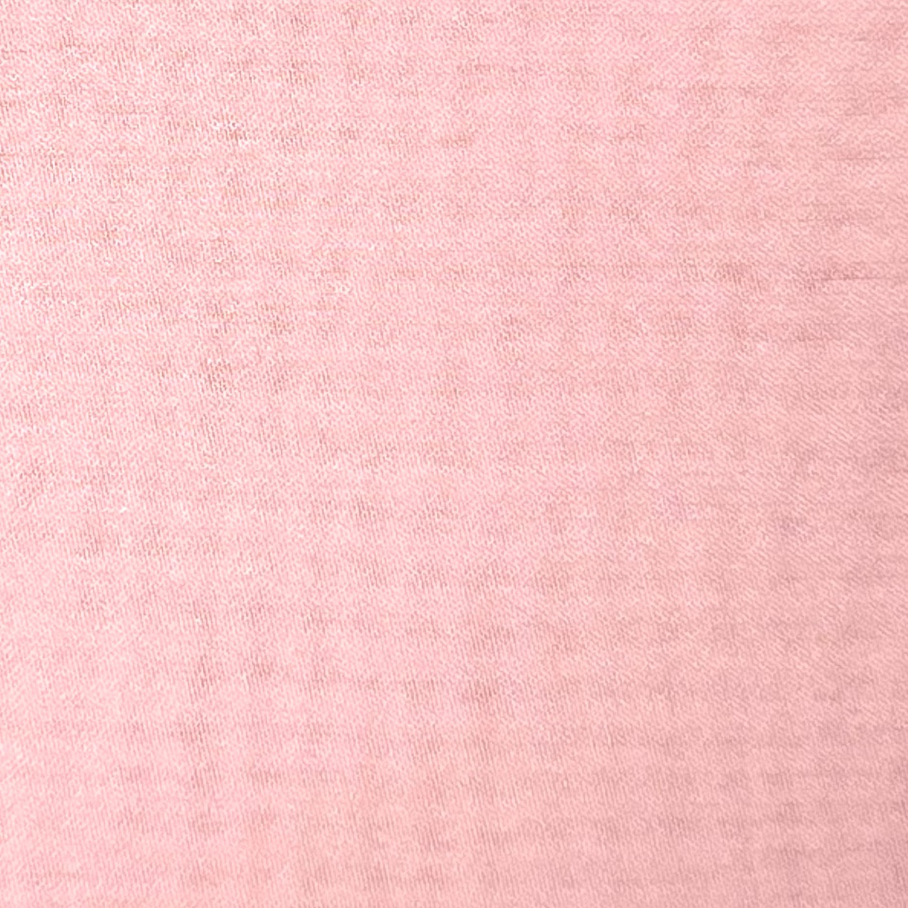 Close-up of high-quality ultra-thin polyester chiffon fabric in a soft pink hue.