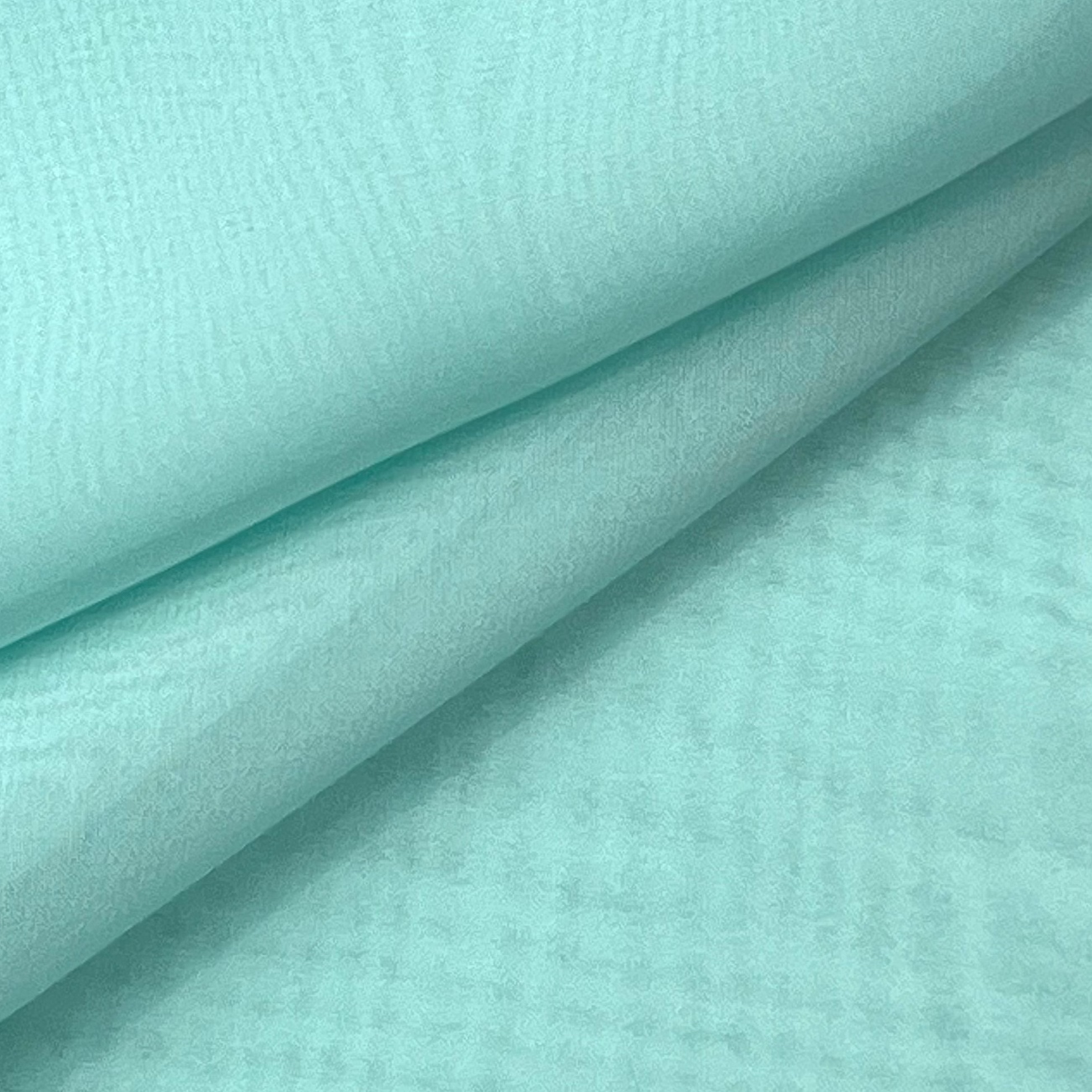 High quality ultra thin polyester chiffon fabric in a light mint green color.