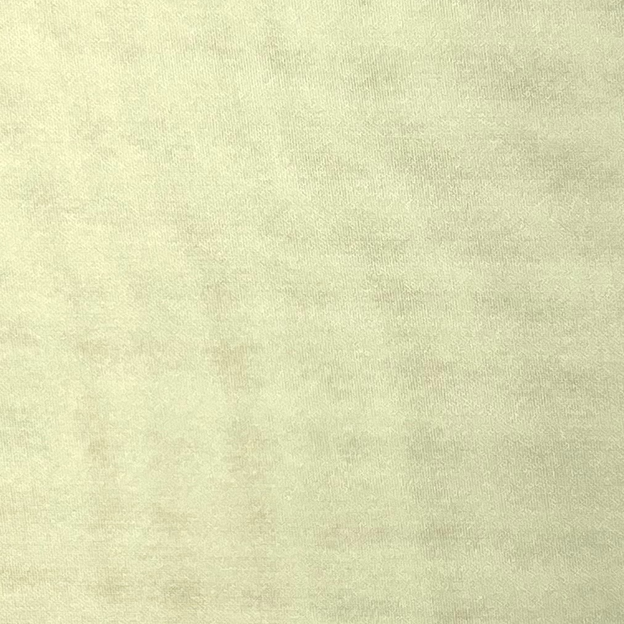 A close-up view of light beige ultra-thin polyester chiffon fabric with a soft matte texture.