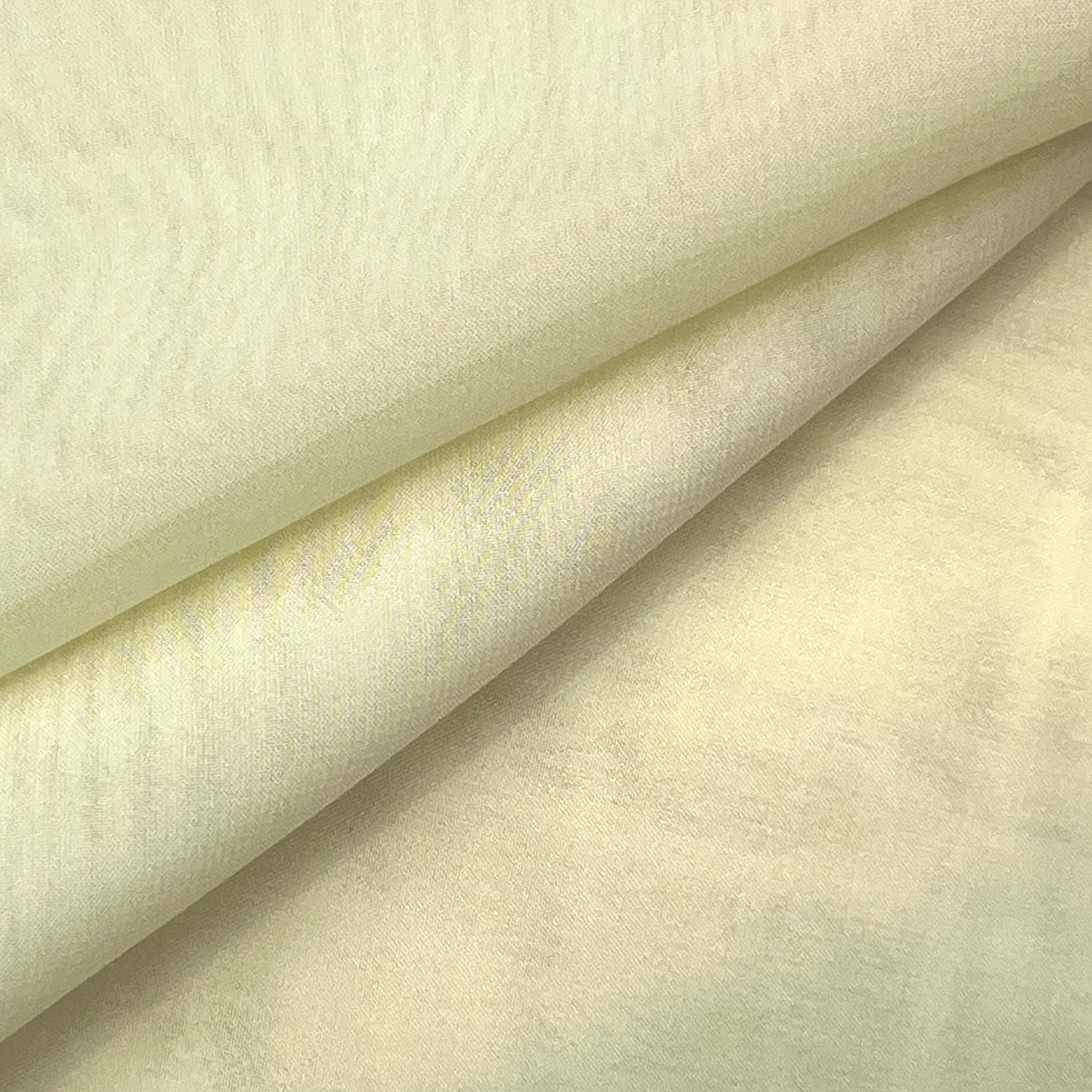 High quality ultra thin polyester chiffon fabric in a soft cream color with a subtle matte texture.