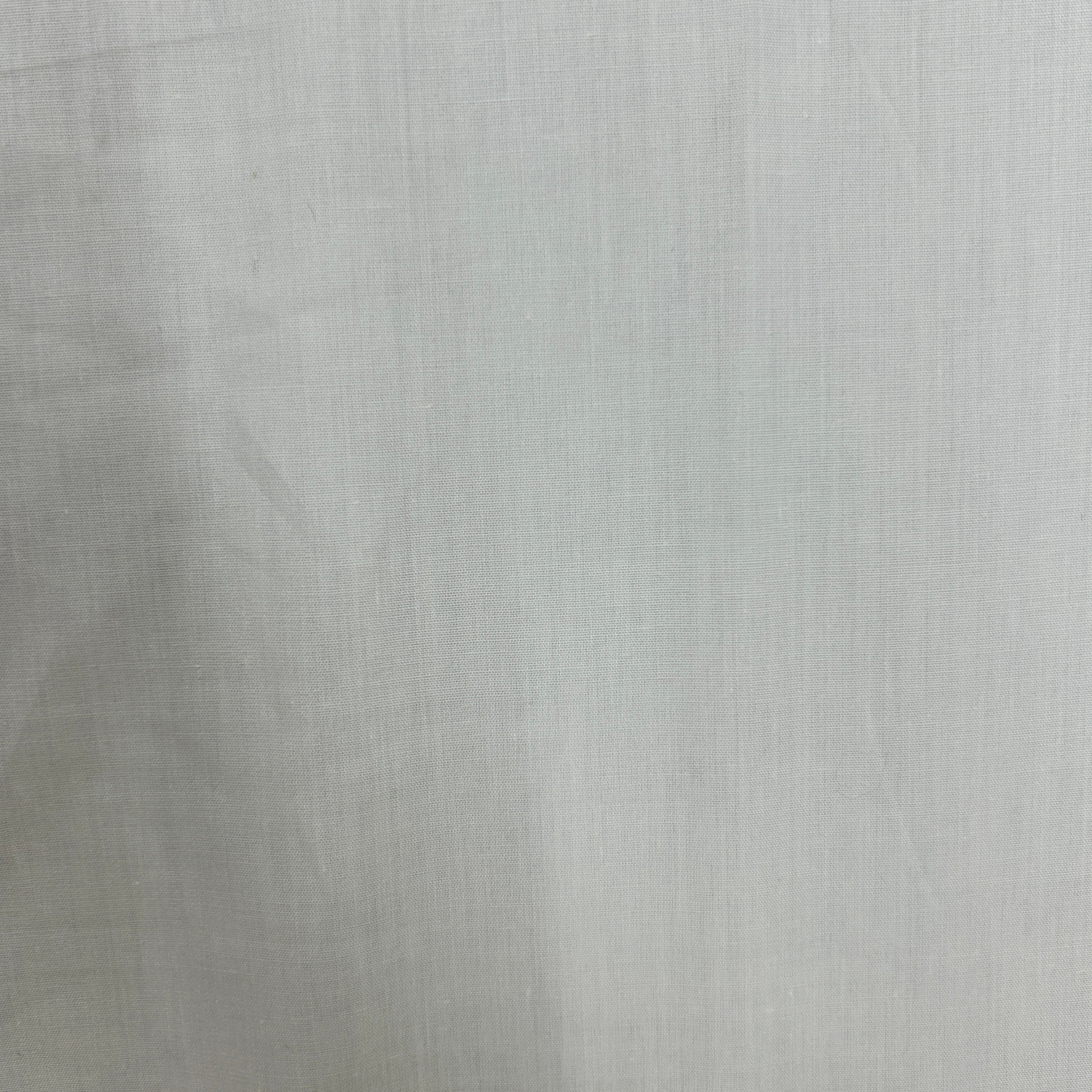 A close-up of a light gray textured fabric with a subtle linen or canvas weave pattern.