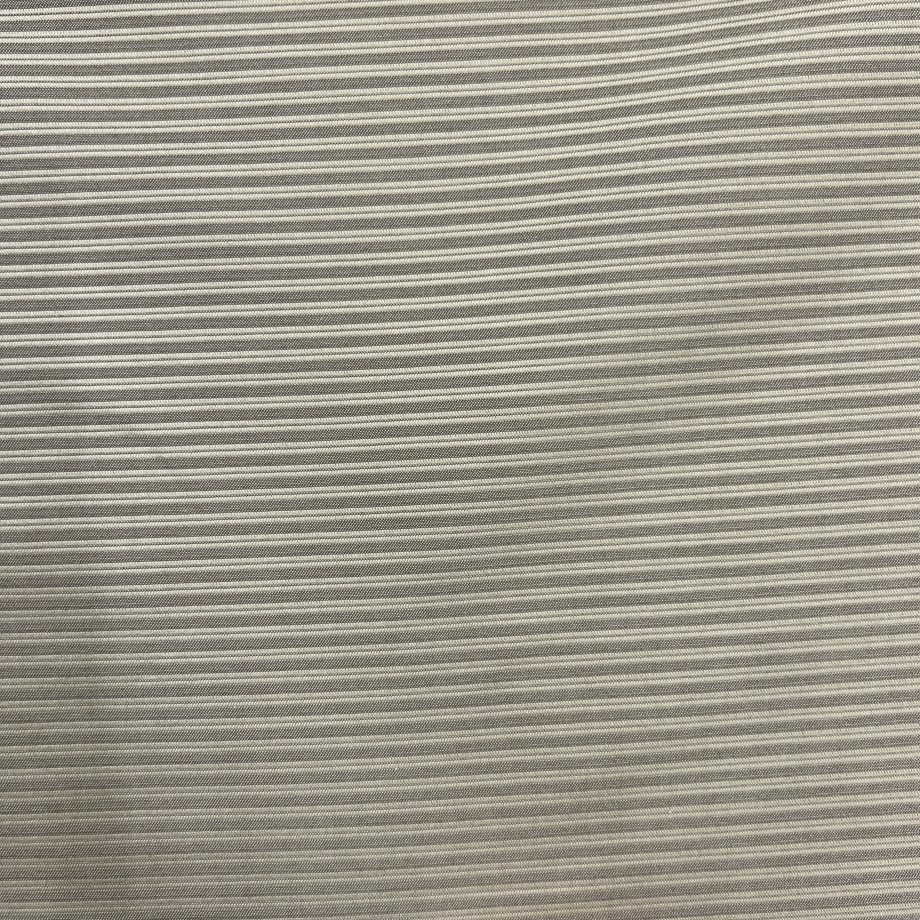A close-up of a striped fabric with thin horizontal stripes in beige and gray.