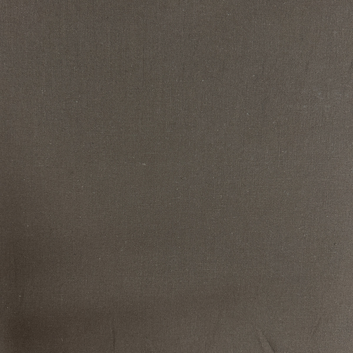 A close-up of a dark brown textured fabric with a fine woven pattern.