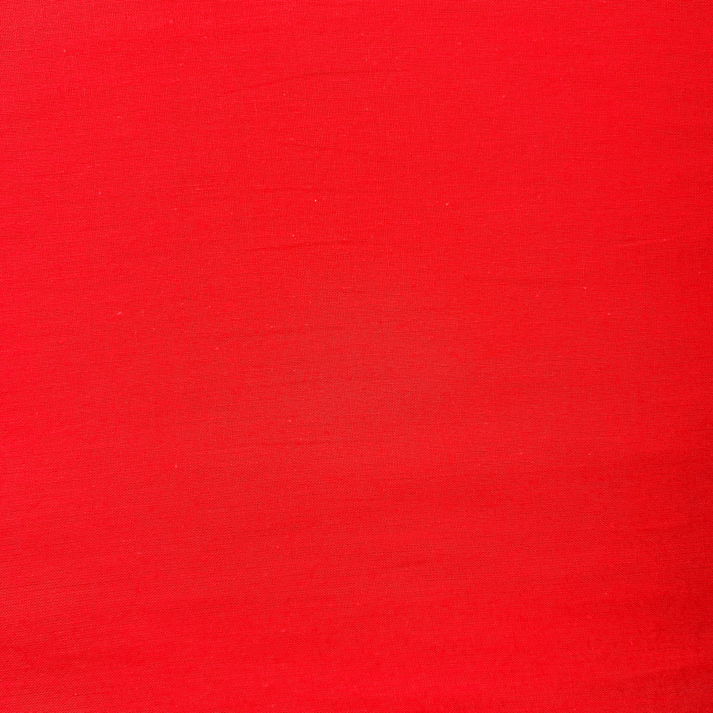 A solid, vibrant red textured surface with subtle horizontal brushstrokes.