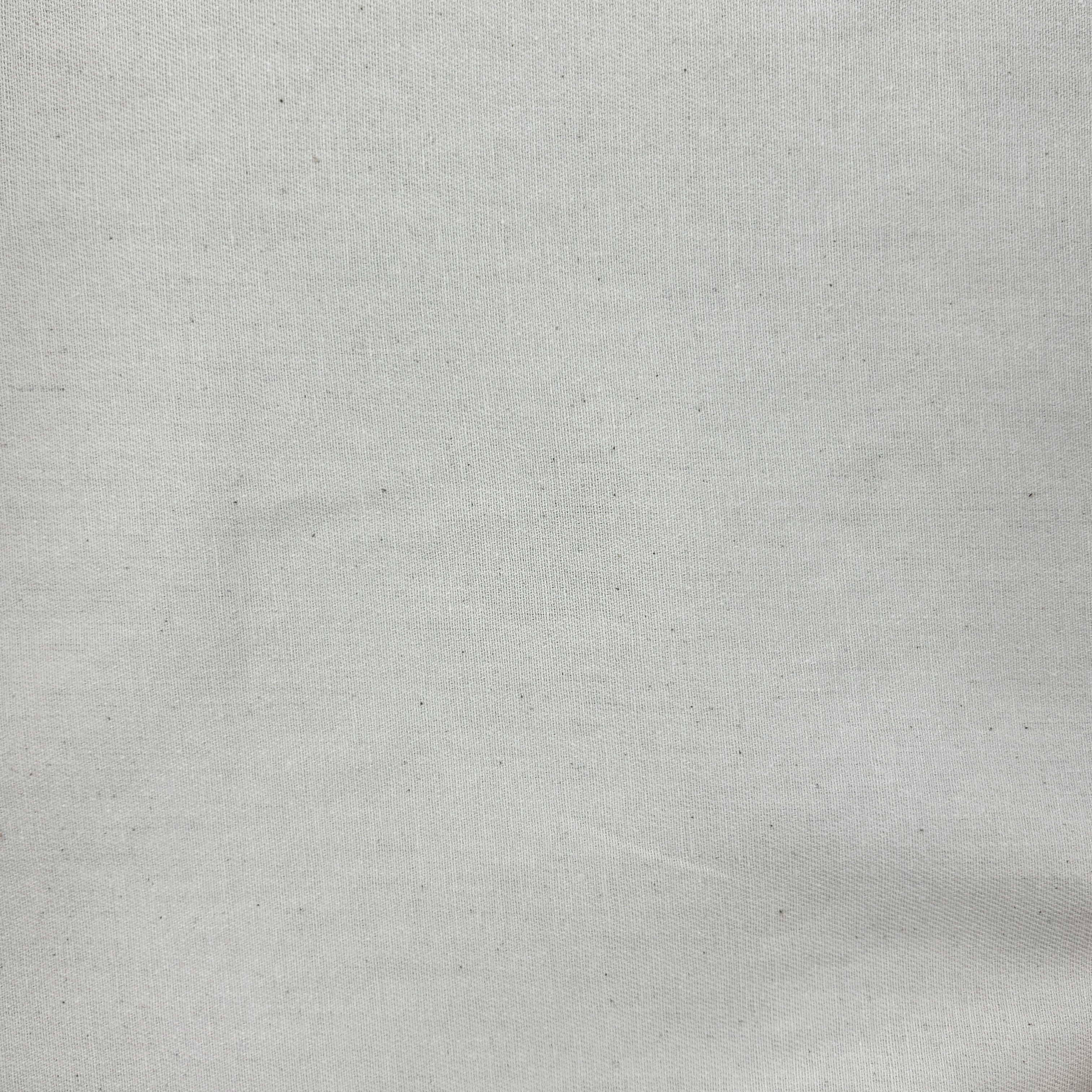 A close-up of a light gray woven fabric texture with subtle speckles and a fine linen-like weave.