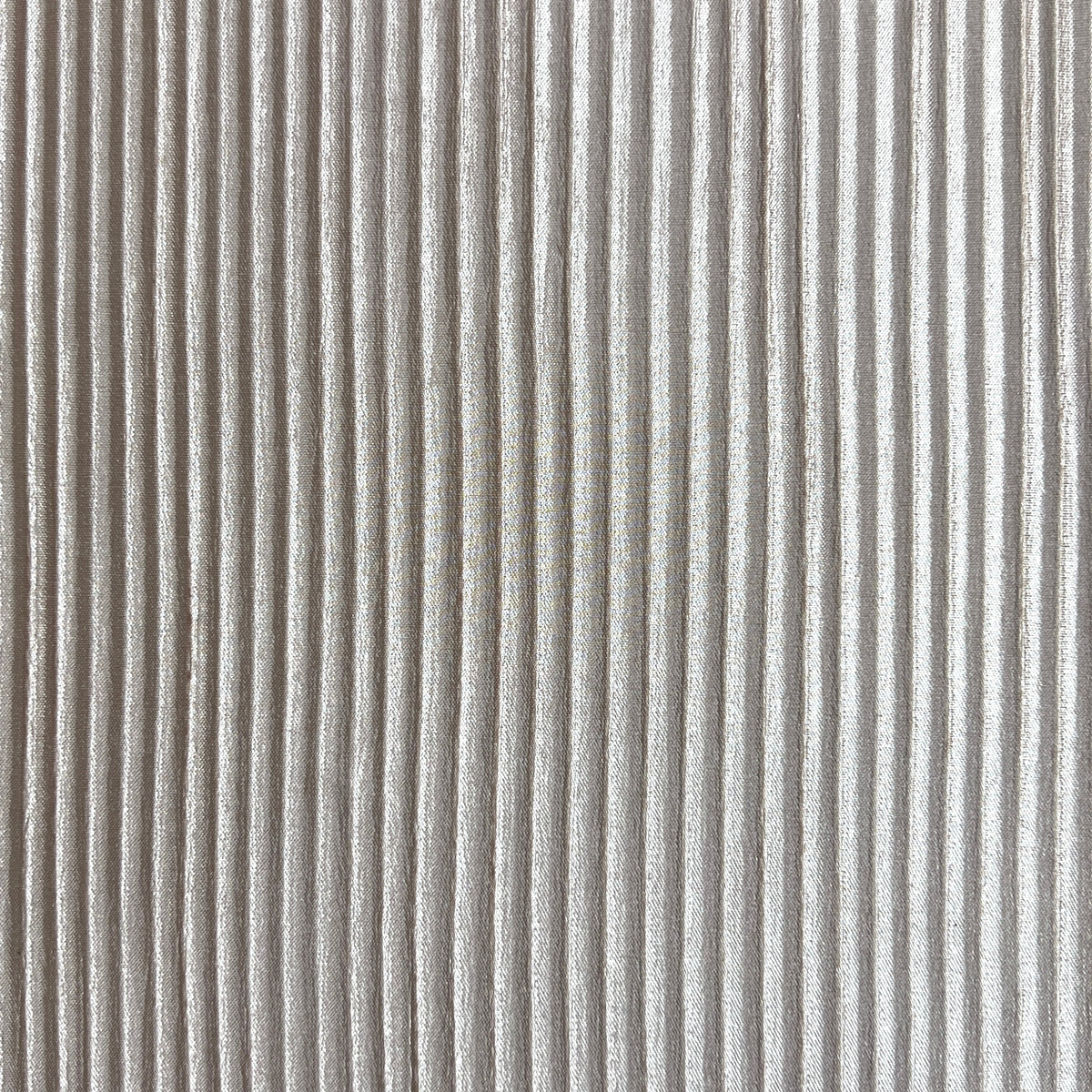 A close-up of a ribbed fabric or material surface with vertical light gray and white stripes.
