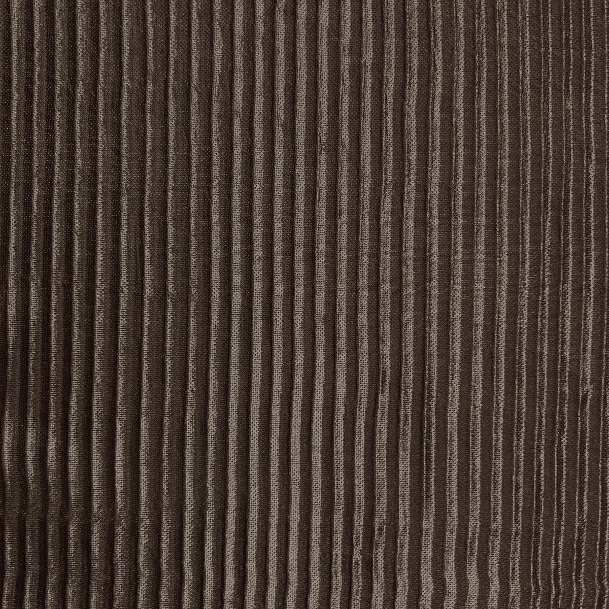 Close-up of a dark brown corduroy fabric with vertical ribbed texture.