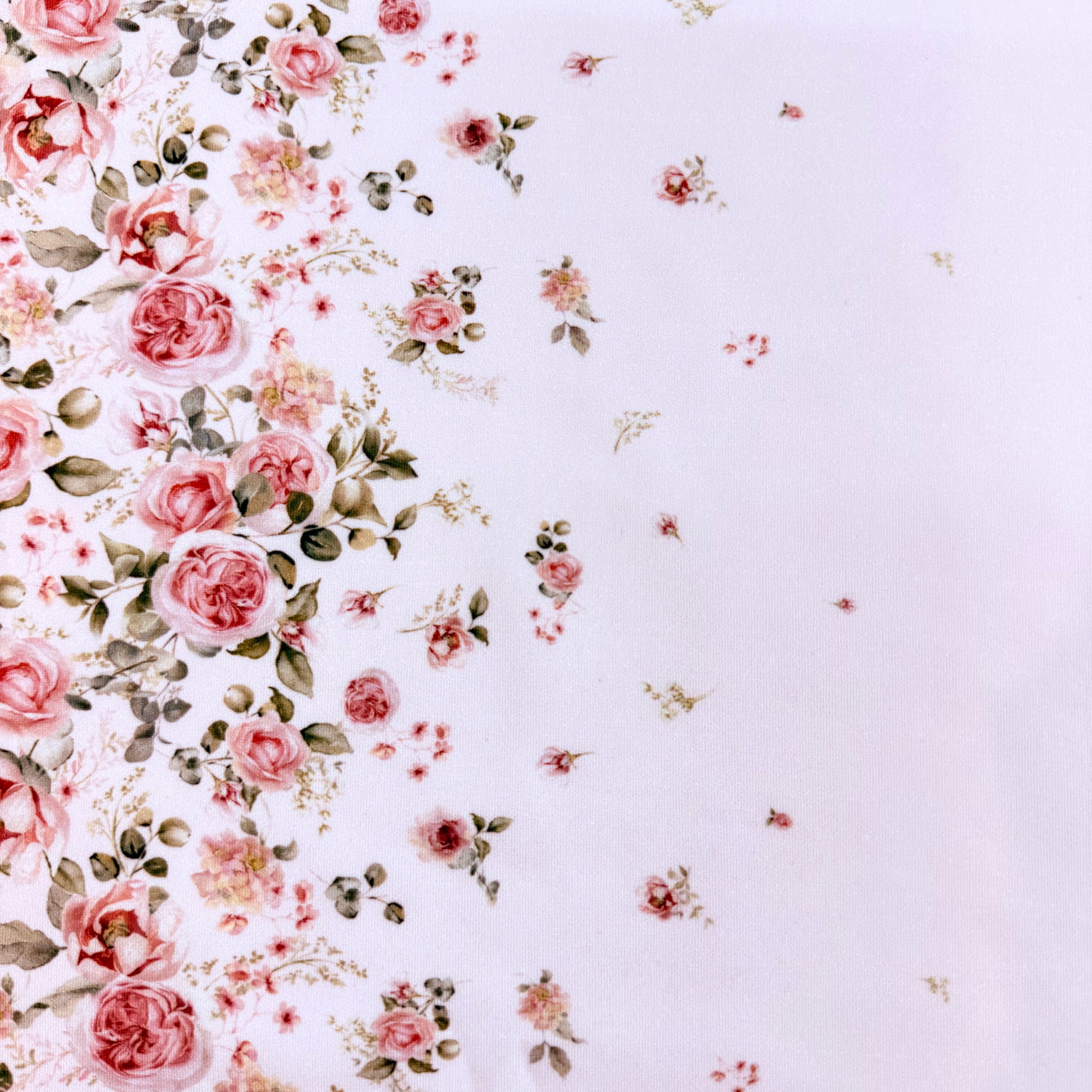 Floral pattern with pink roses and green leaves on a light purple background