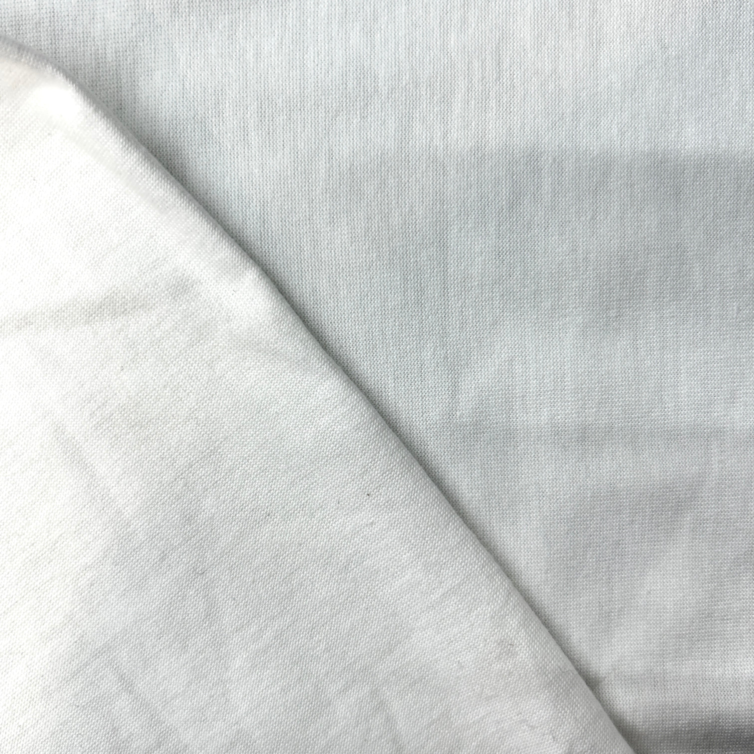Close-up of white fabric with a subtle texture