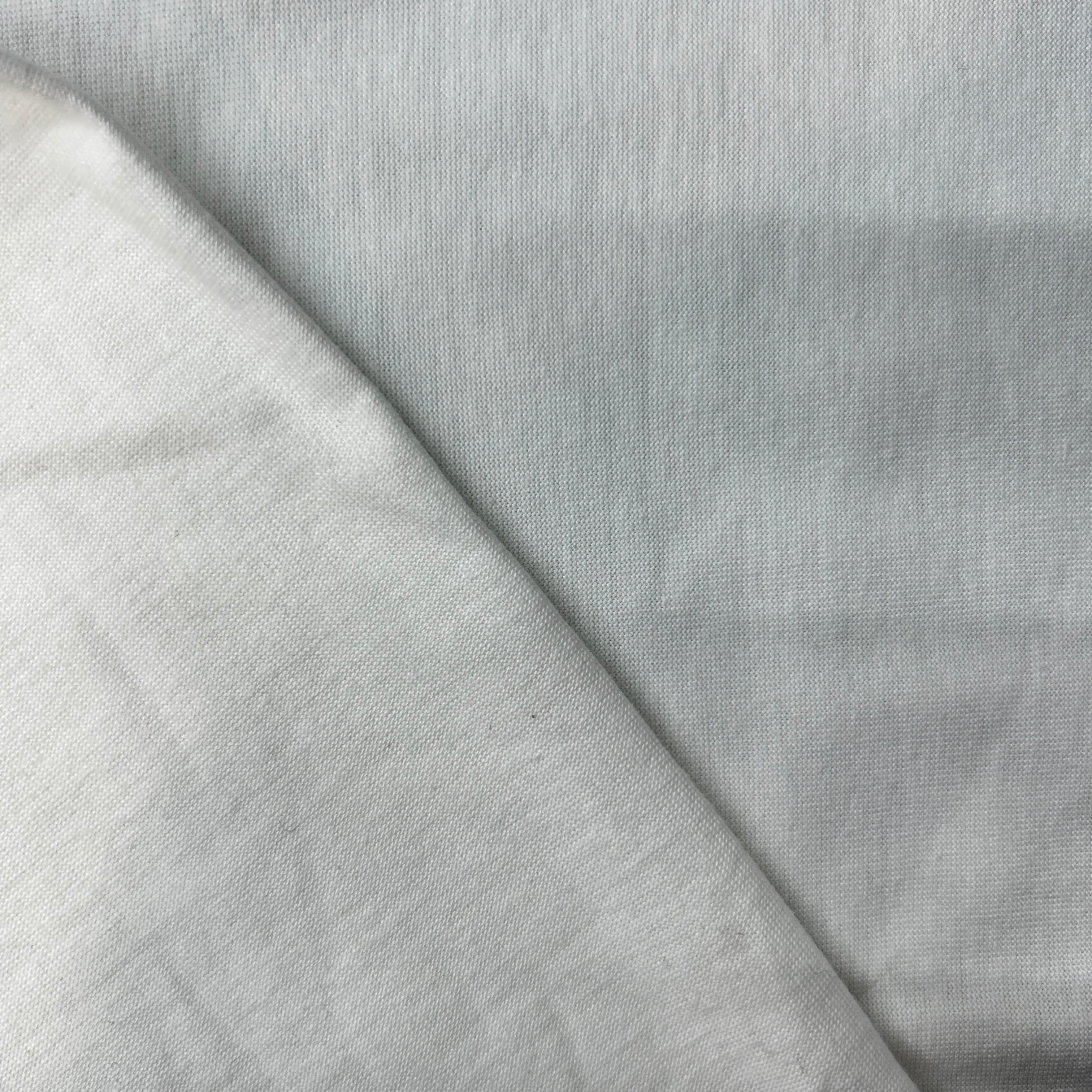 Close-up of white fabric with a subtle texture