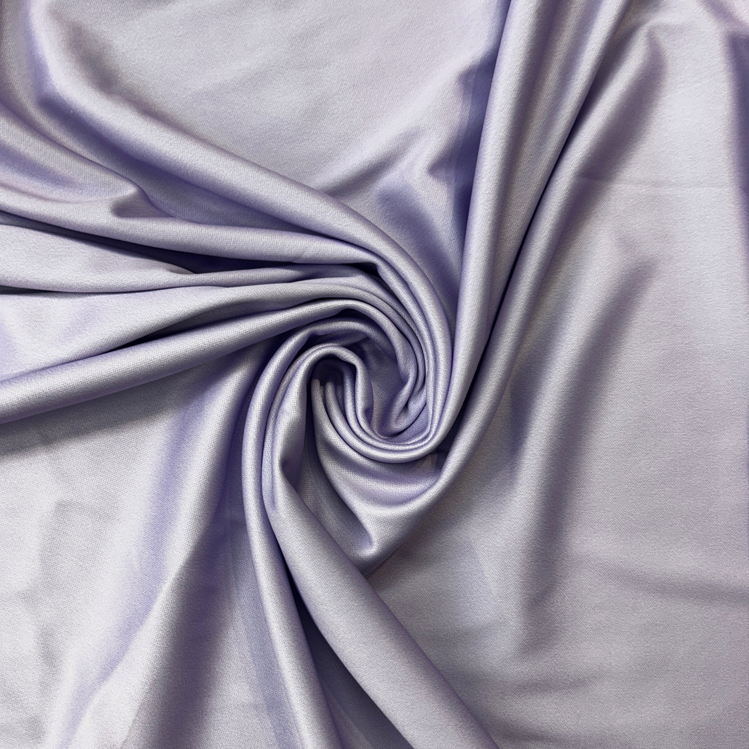 Close-up of purple fabric with folds