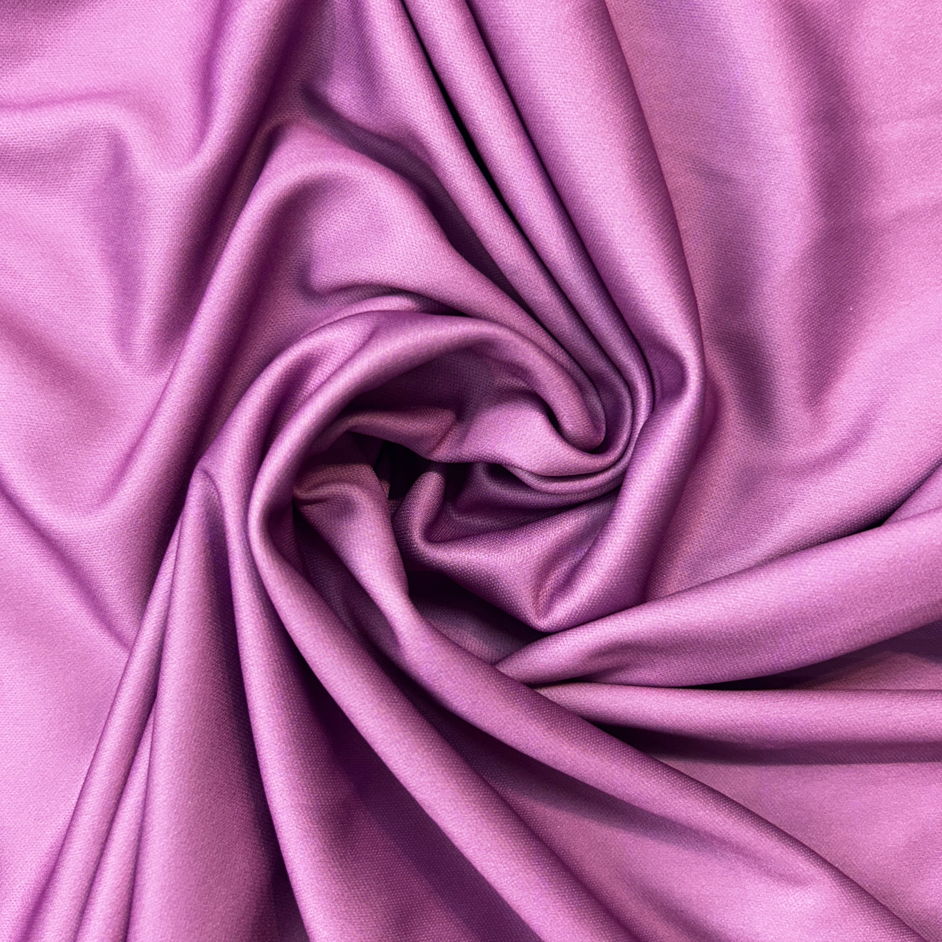 Close-up of purple fabric with folds