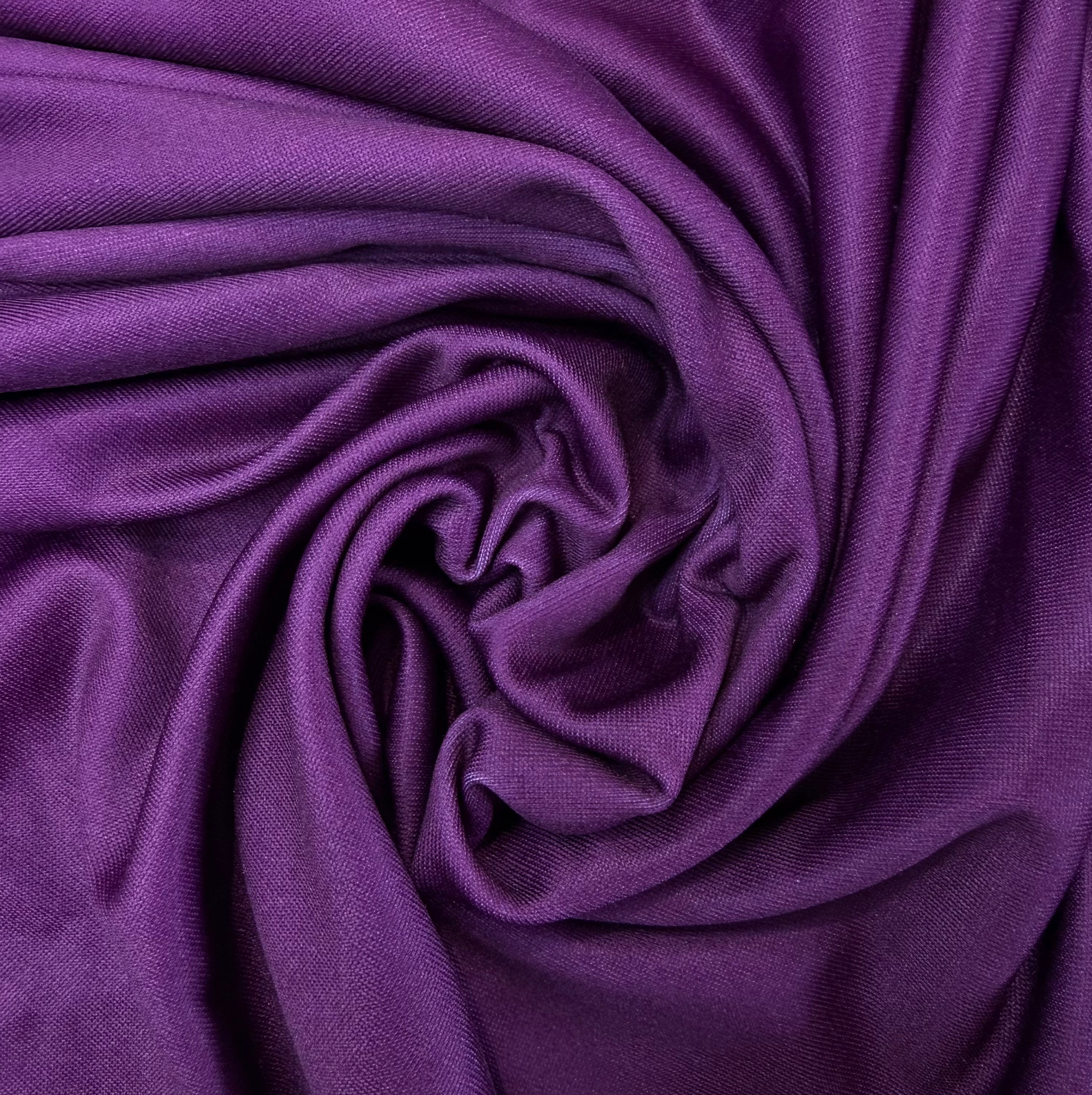 Close-up of purple fabric with folds