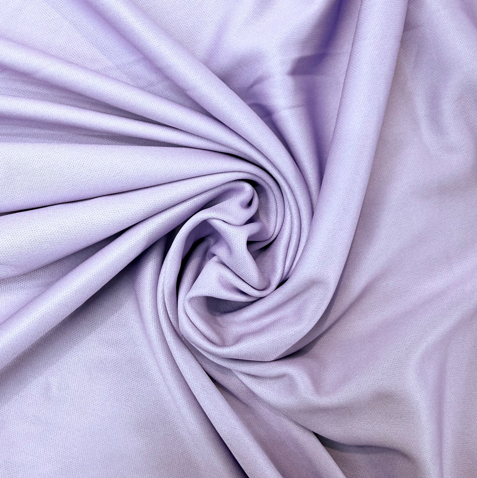 Close-up of purple fabric with folds