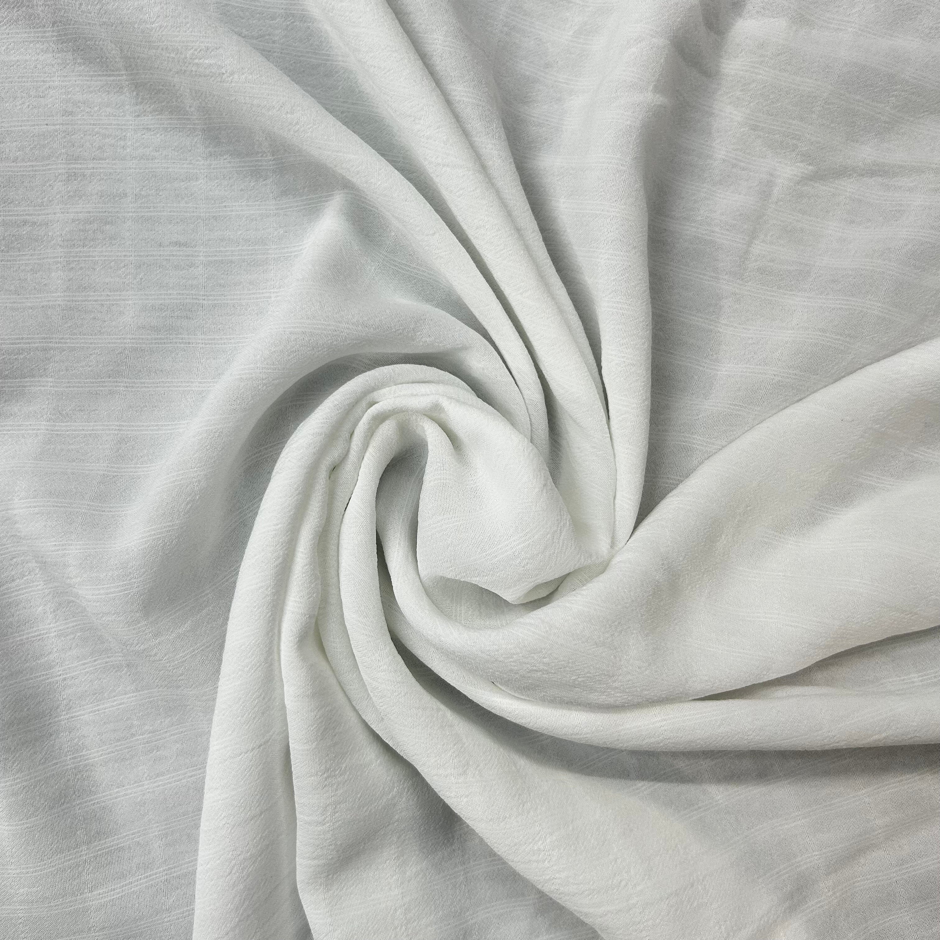 Close-up of light gray fabric with a subtle texture