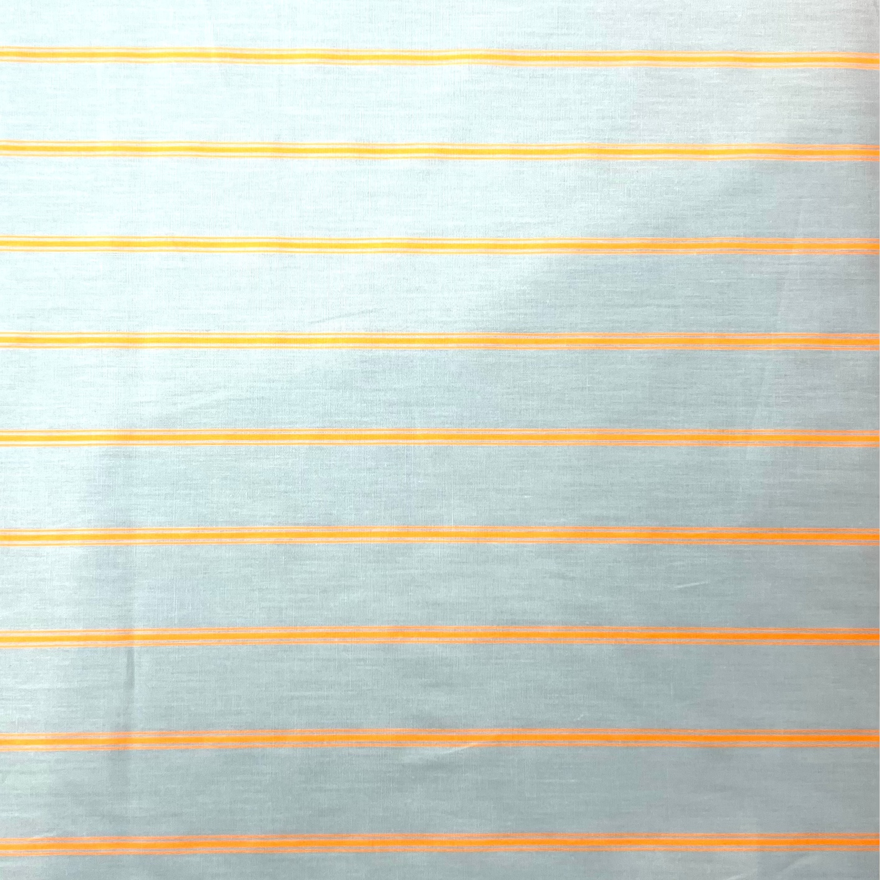 Close-up of fabric with thin orange stripes on a light gray background