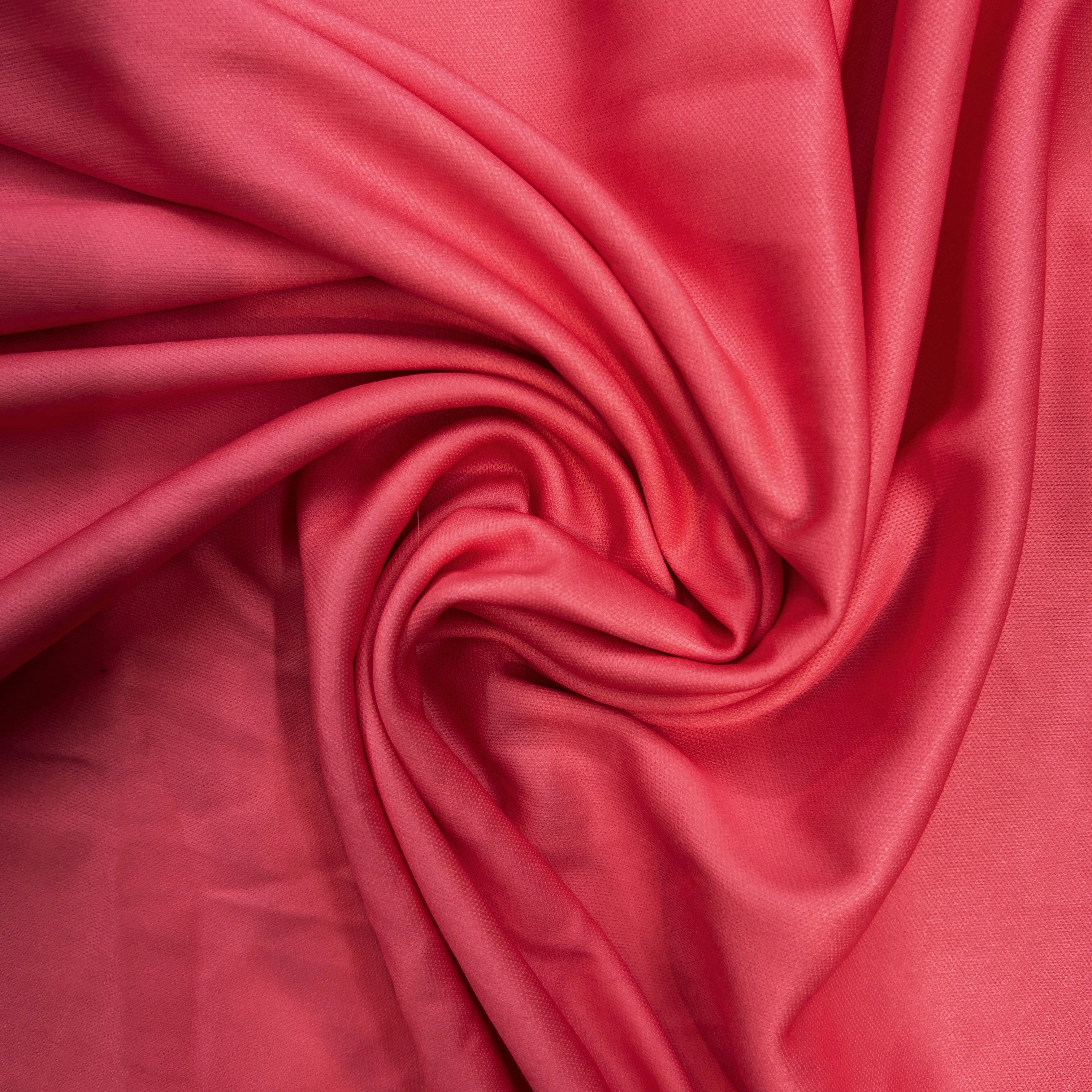 Close-up of pink fabric with a swirl pattern