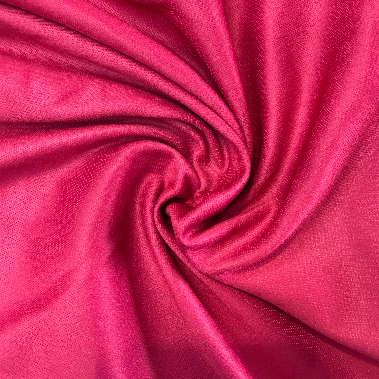 Close-up of pink fabric with a swirl pattern