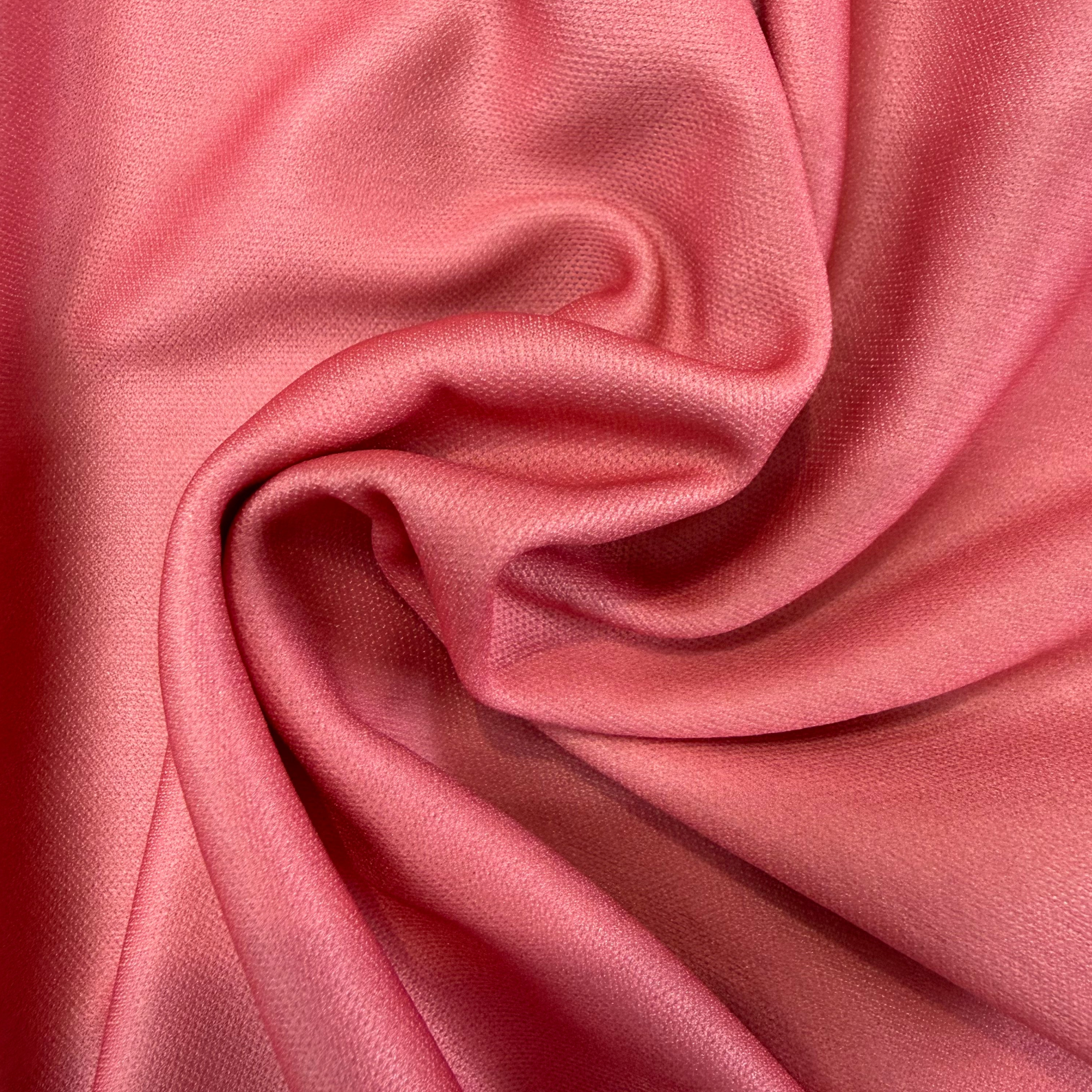 Close-up of pink fabric with folds