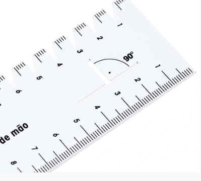 White plastic hand gauge with centimeter scale and 90 degree angle marking.