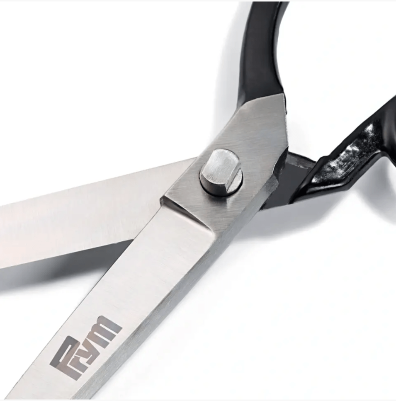 Black hardened steel tailor's scissors with ergonomic handle.