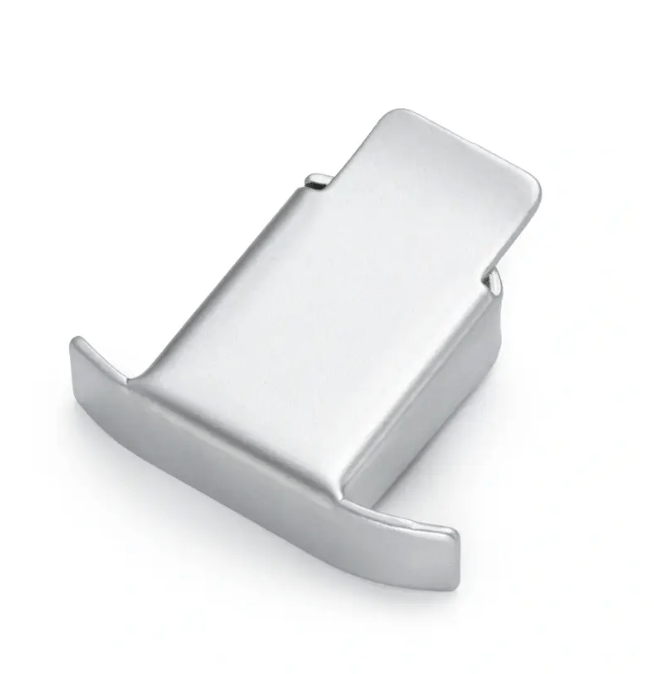 Silver-coloured magnetic steel seam guide for sewing machines.